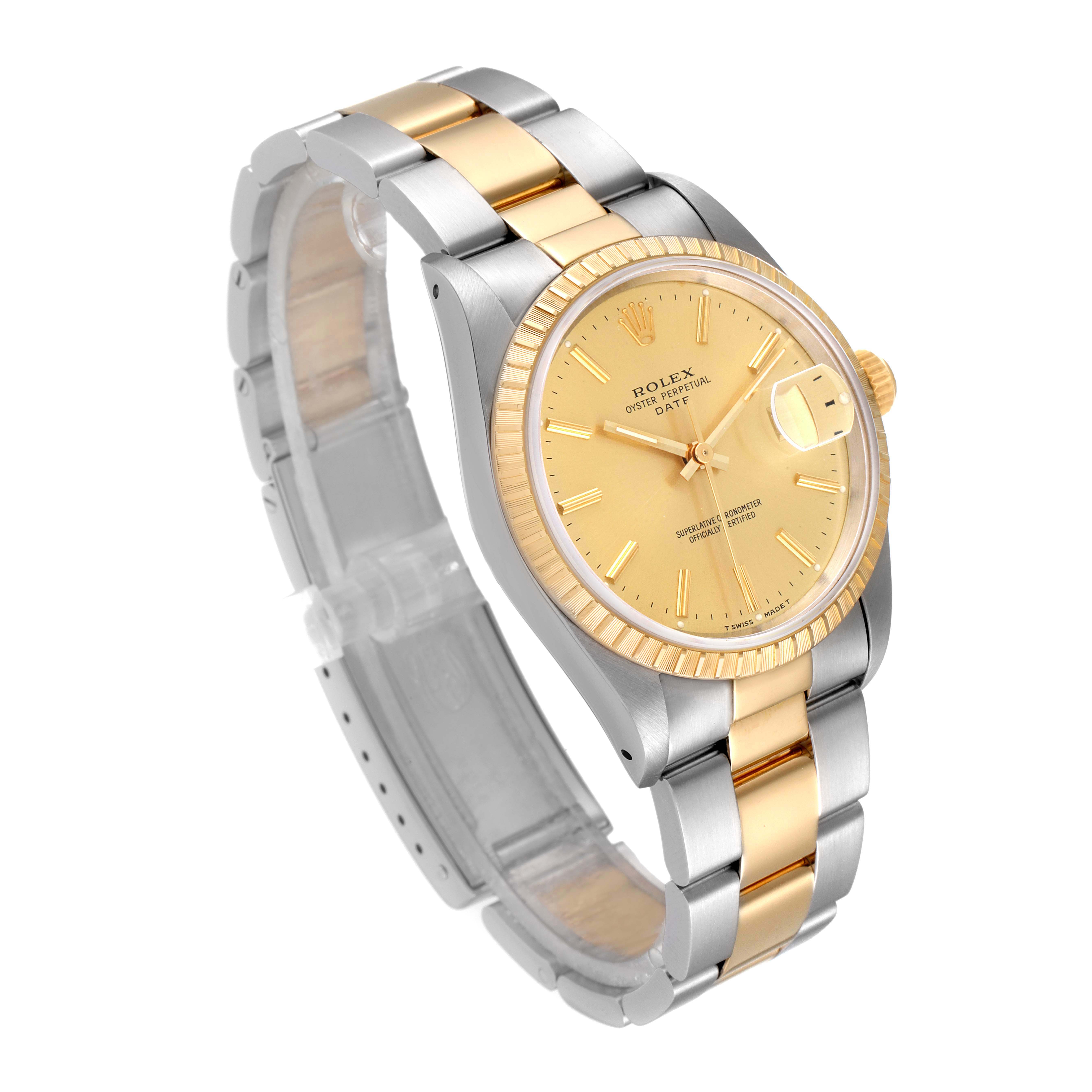 This image shows a Rolex Date 15223 Men's Steel and Gold (two tone) Champagne Dial 15223 Men's Steel and Gold (two tone) Champagne Dial model watch at an angle displaying its gold and silver bracelet, gold dial, and fluted bezel.
