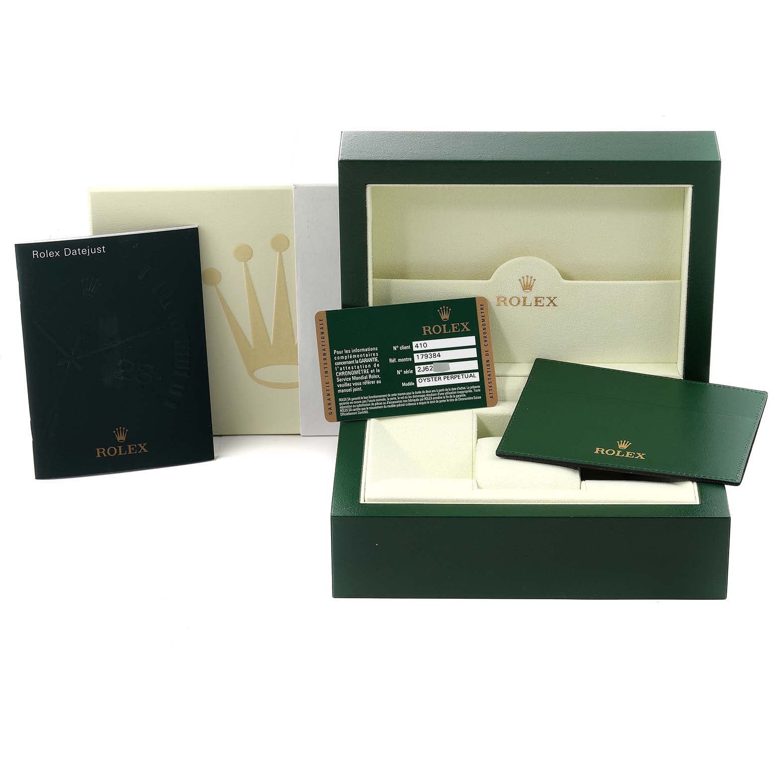 The image shows the packaging and accessories of a Rolex Datejust 179384 Women's Stainless Steel Silver Dial 179384 Women's Stainless Steel Silver Dial watch, including a box, booklets, and warranty card.