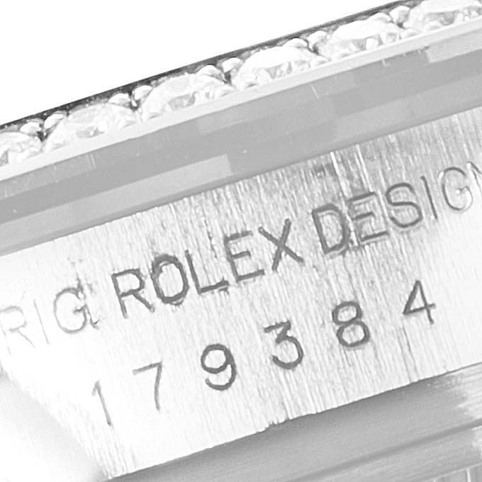 This image shows the side view of the Rolex Datejust 179384 Women's Stainless Steel Silver Dial 179384 Women's Stainless Steel Silver Dial model, focusing on the engraved serial number and "ROLEX DESIGN" text.