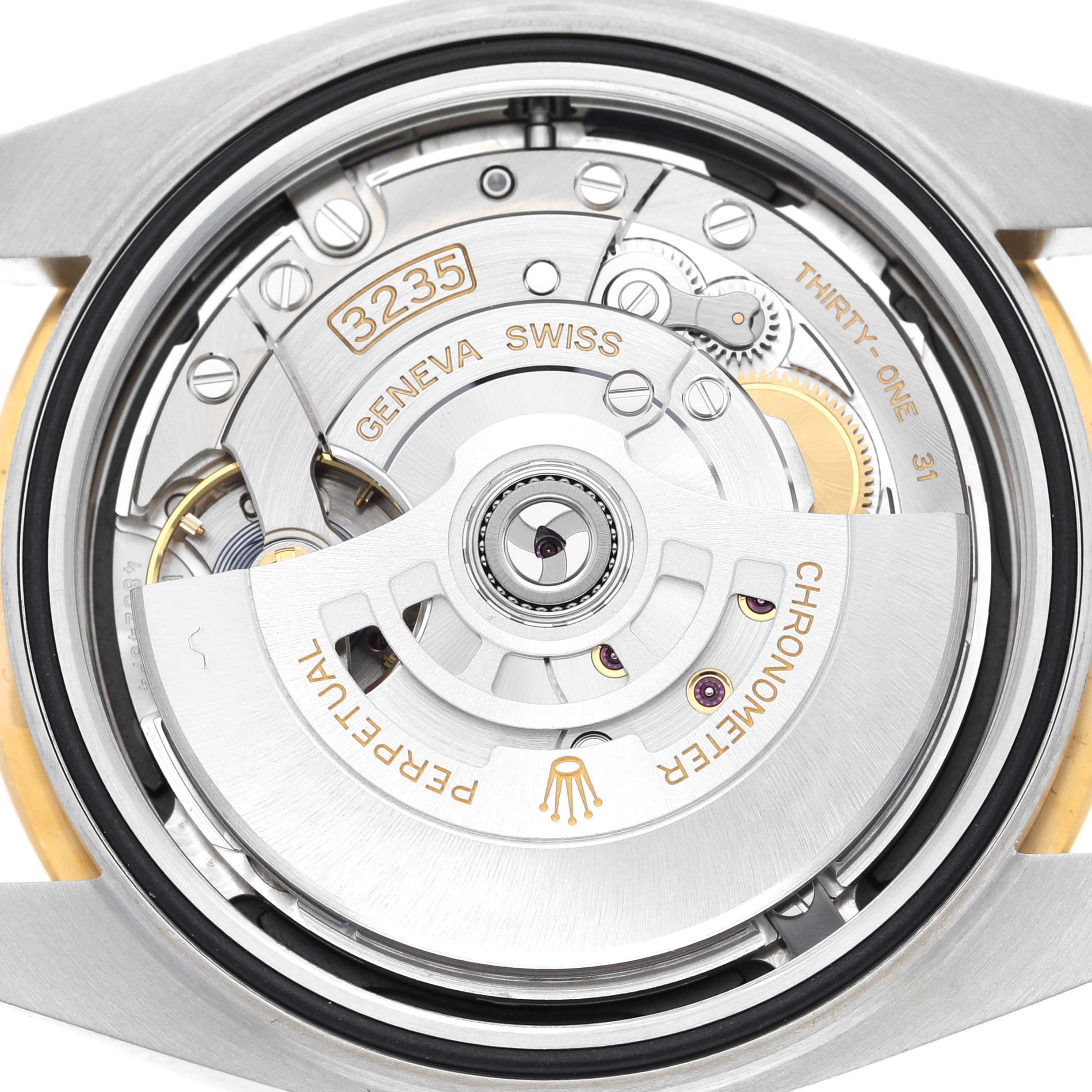 This image shows the movement mechanism of a Rolex Datejust 41 126333 Men's Steel and Gold (two tone) Black Dial 126333 Men's Steel and Gold (two tone) Black Dial watch from a back angle, highlighting its intricate inner workings.
