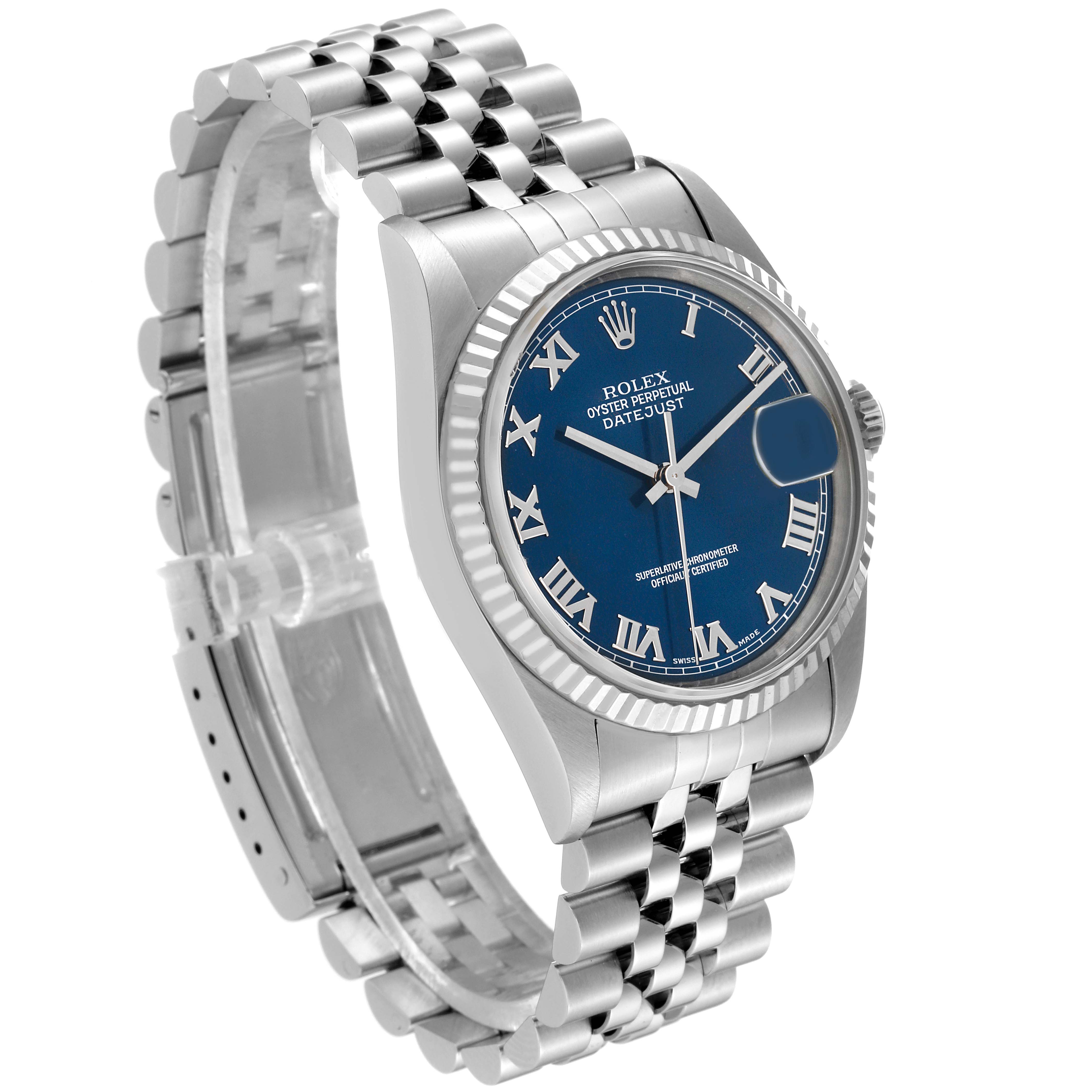 This Rolex Datejust 16234 Men's Stainless Steel Blue Dial 16234 Men's Stainless Steel Blue Dial watch is shown from a 3/4 angle, highlighting its blue Roman numeral dial, fluted bezel, and Jubilee bracelet.