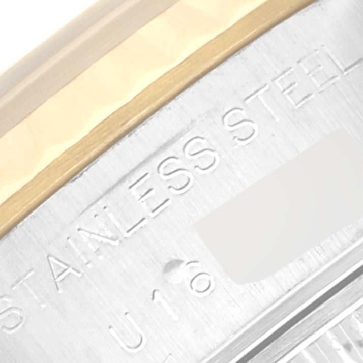 The image shows a close-up of the side of a stainless steel and gold Rolex Datejust 69173 Women's Steel and Gold (two tone) Champagne Dial 69173 Women's Steel and Gold (two tone) Champagne Dial watch case.