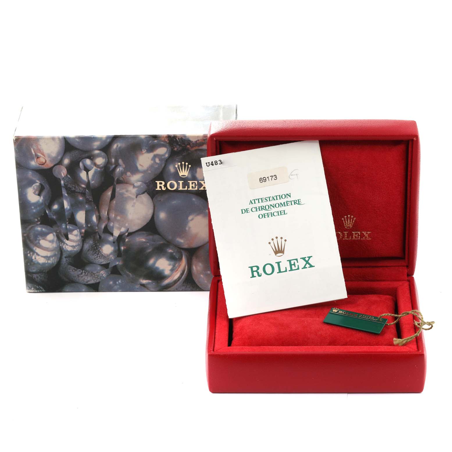 The image shows the packaging and documentation of a Rolex Datejust 69173 Women's Steel and Gold (two tone) Champagne Dial 69173 Women's Steel and Gold (two tone) Champagne Dial watch, including a box and certificate.