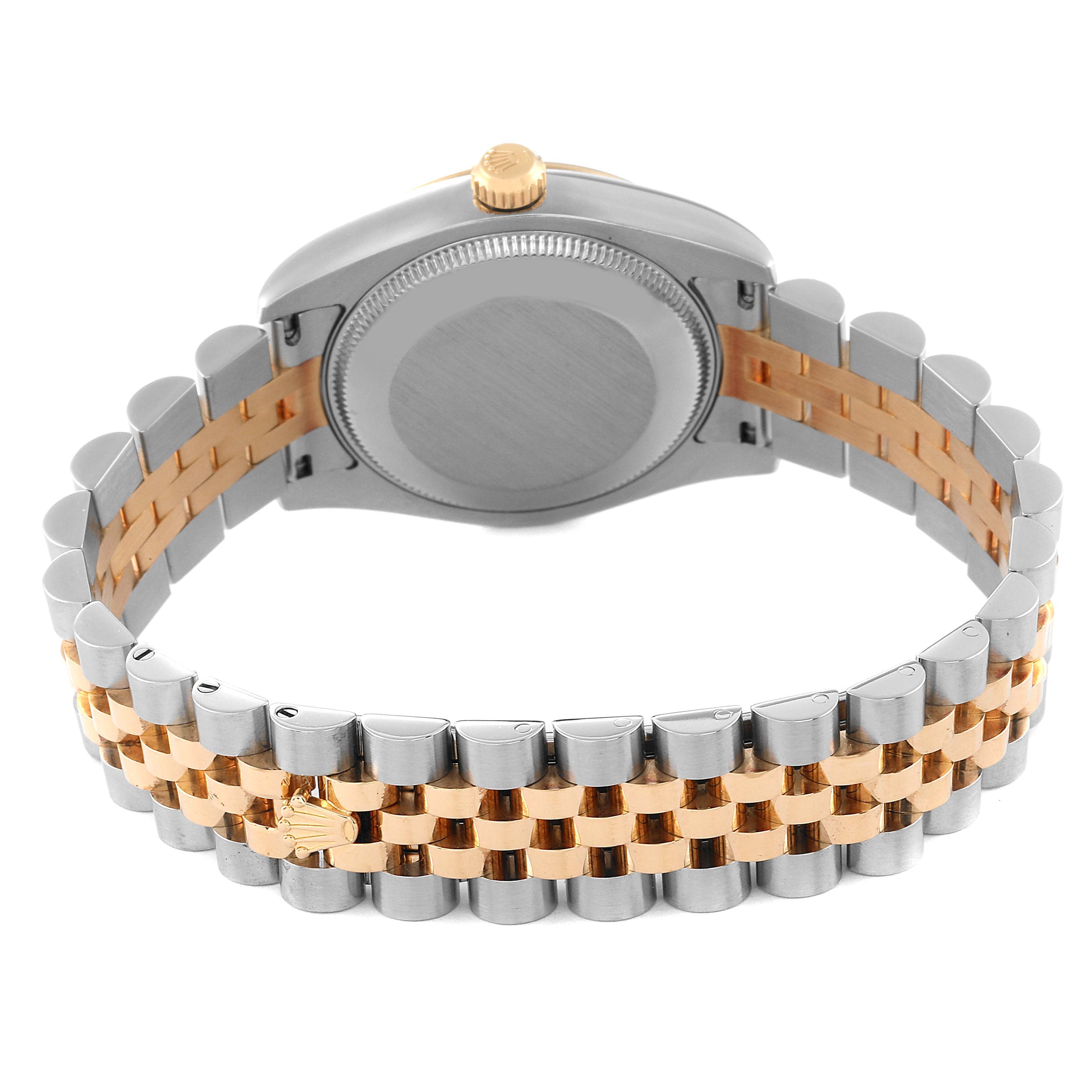 The image shows a rear view of a Rolex Mid-Size 178273 Women
s Steel and Gold (two tone) Black Dial 178273 Women
s Steel and Gold (two tone) Black Dial model watch, highlighting its case back and two-tone bracelet.