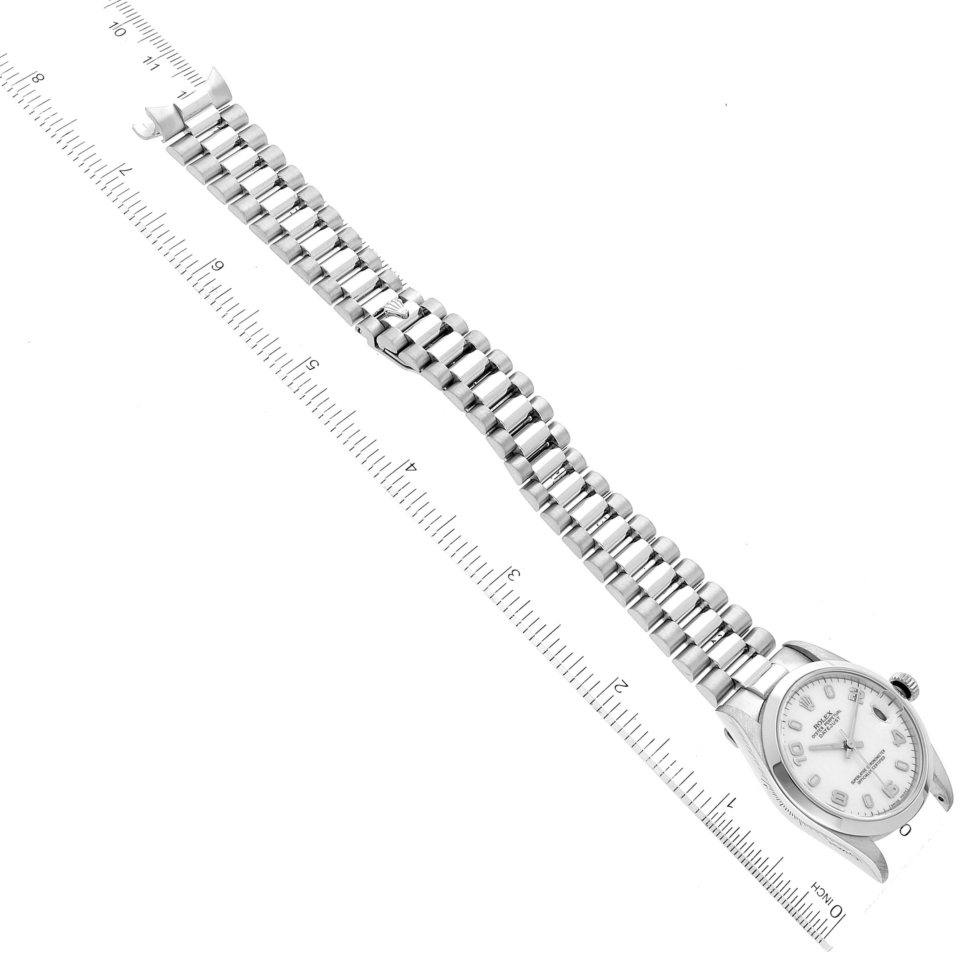 The image shows a Mid-Size Rolex watch with a metal bracelet laid flat next to a ruler, displaying the full length.
