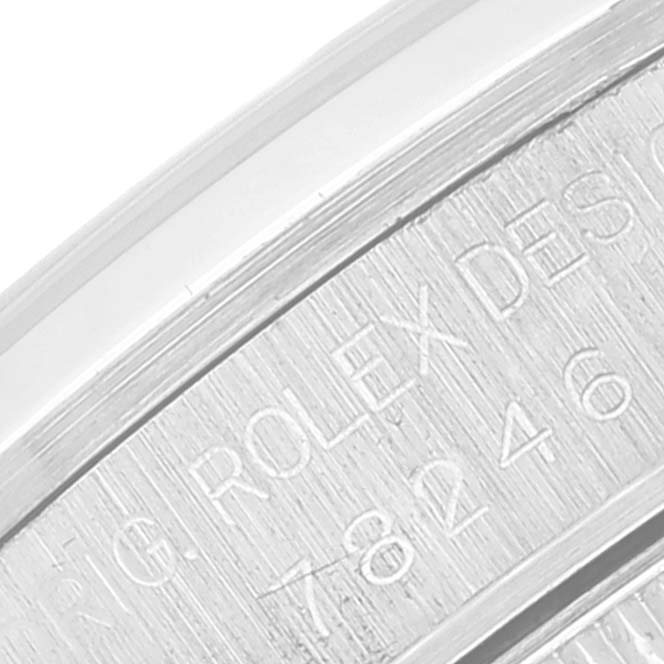 The image shows a close-up of the engraved inner bezel of a Rolex Mid-Size 78246 Women's Platinum White Dial 78246 Women's Platinum White Dial model watch.
