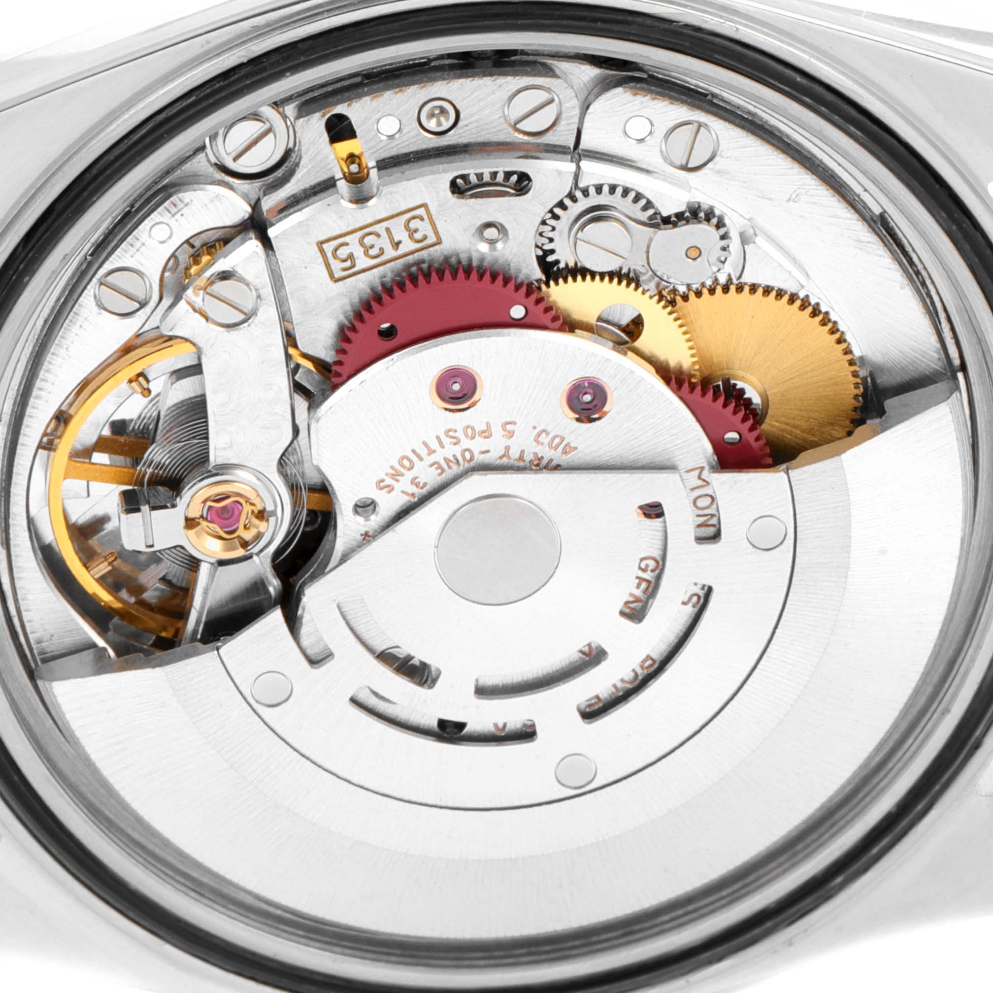 This image shows an internal view of the Rolex Datejust 16220 Men's Stainless Steel Silver Dial 16220 Men's Stainless Steel Silver Dial watch, highlighting its intricate movement and mechanical components.
