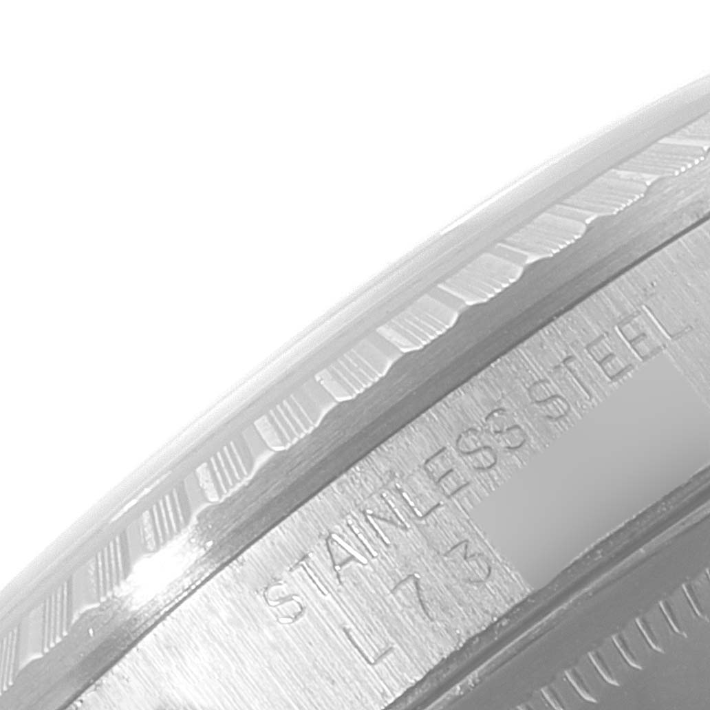 This image shows a close-up of the engraved outer rim of the case back of a Rolex Datejust 16220 Men's Stainless Steel Silver Dial 16220 Men's Stainless Steel Silver Dial watch in stainless steel.