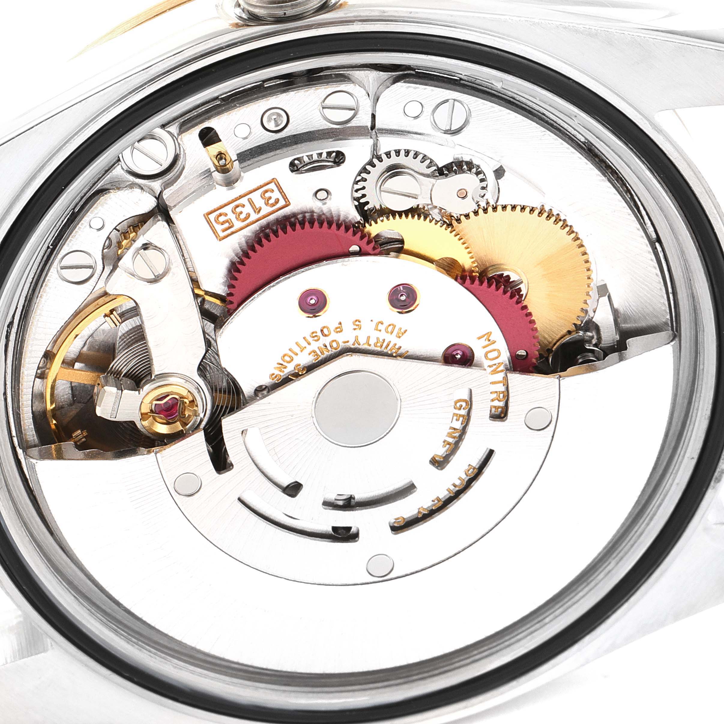 This image shows the intricate internal mechanism of a Rolex Datejust 16233 Men's Steel and Gold (two tone) White Dial 16233 Men's Steel and Gold (two tone) White Dial watch, highlighting gears and the automatic movement.