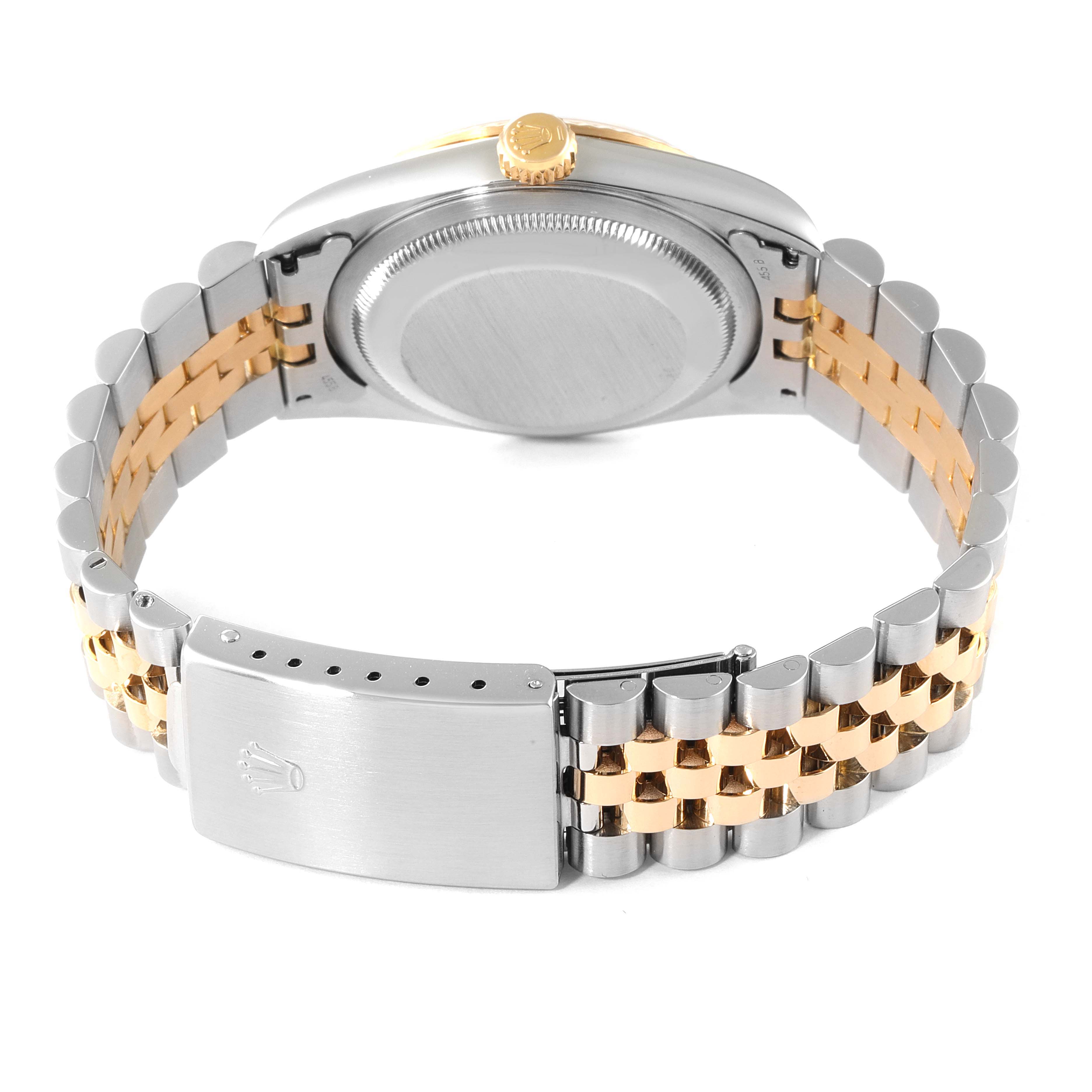 The image shows the back of a Rolex Datejust 16233 Men's Steel and Gold (two tone) White Dial 16233 Men's Steel and Gold (two tone) White Dial watch and its two-tone bracelet with the clasp.