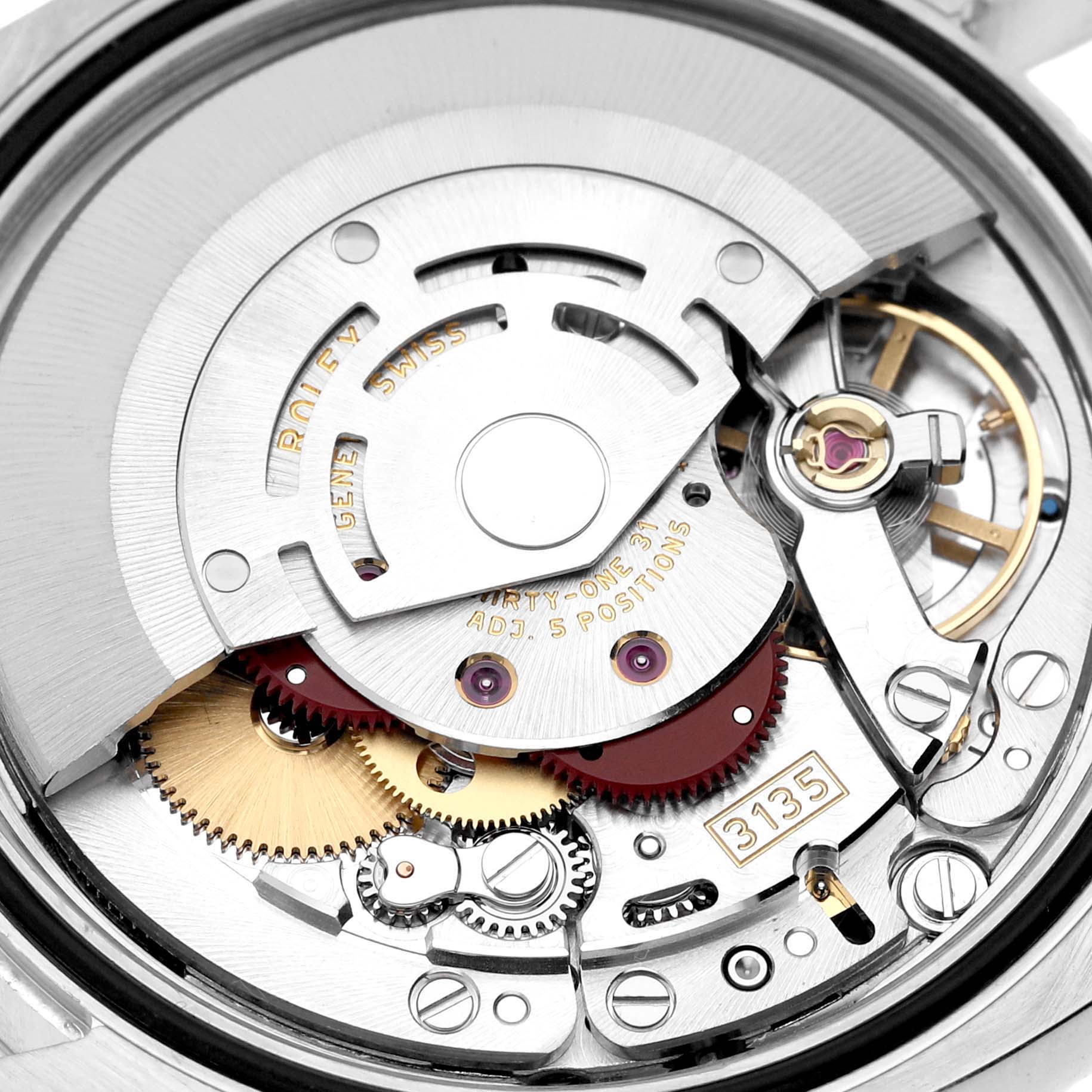 The image shows a close-up of the movement inside a Rolex Datejust 116234 Men's Stainless Steel Silver Dial 116234 Men's Stainless Steel Silver Dial watch model, revealing intricate gears and the balance wheel.