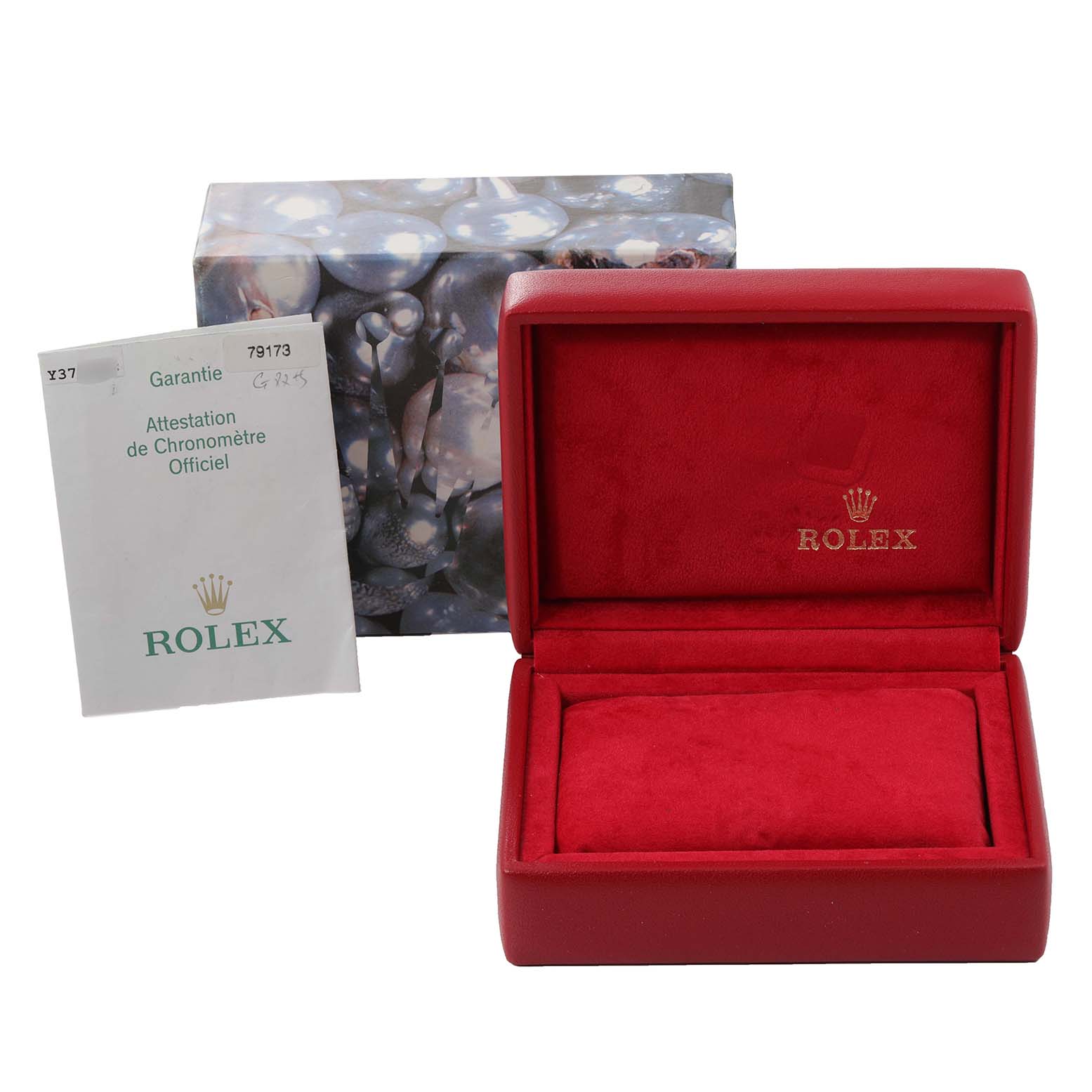 The image shows a Rolex Datejust 79173 Women's Steel and Gold (two tone) Blue Dial 79173 Women's Steel and Gold (two tone) Blue Dial watch's red display box, a warranty booklet, and an outer box with a bubble-like design.