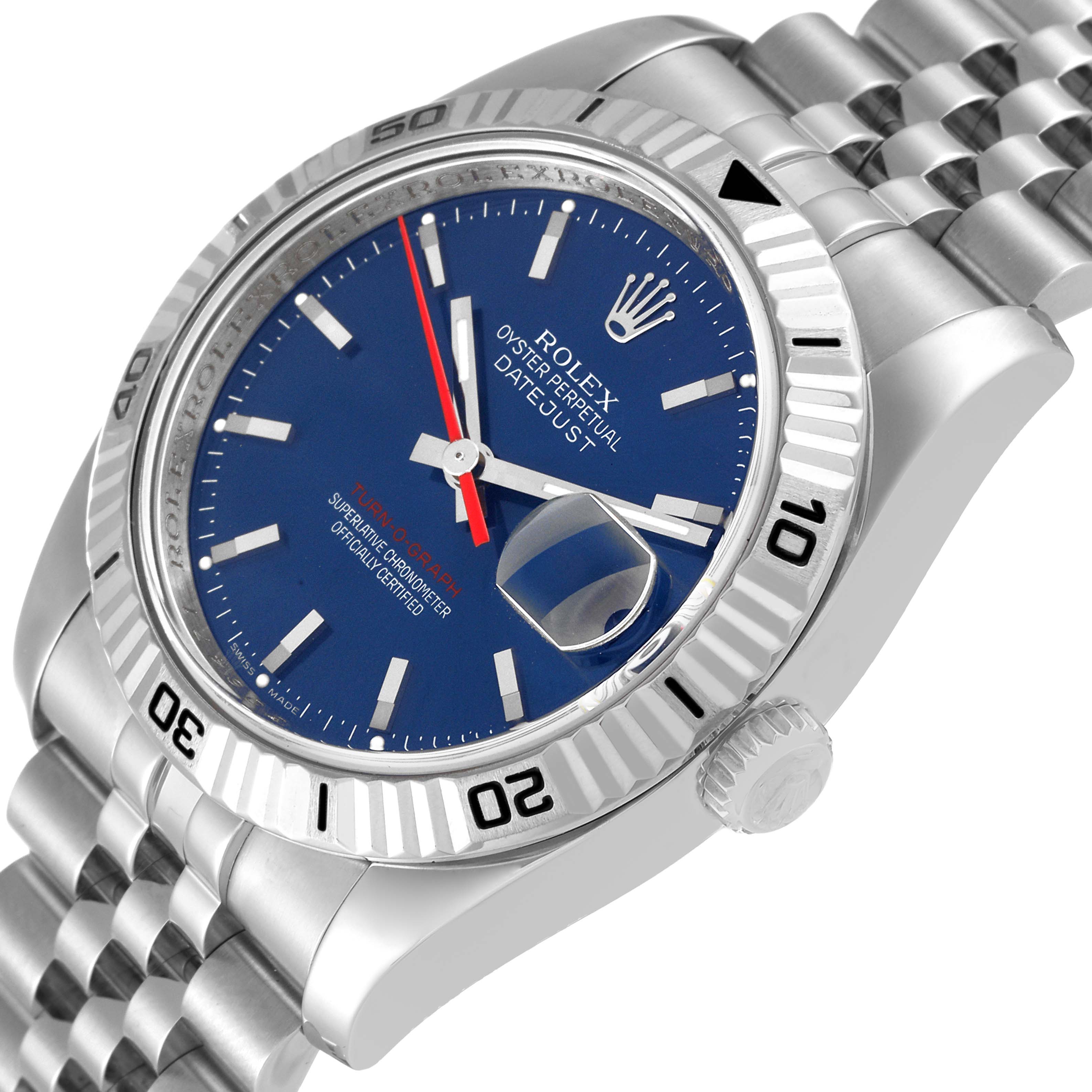 The image shows a Turn-O-Graph Rolex watch at a slight top-side angle, highlighting its blue dial, bezel, and bracelet.