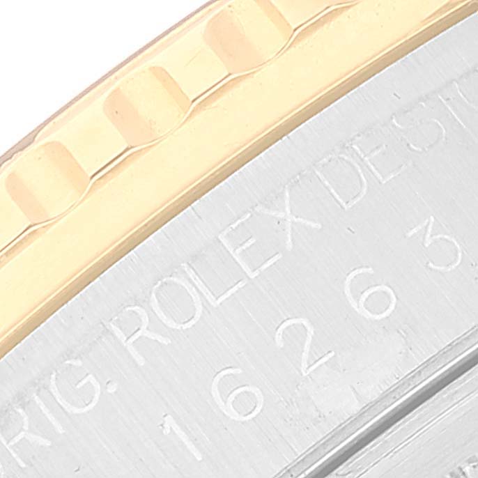 This close-up image shows the engraved details on the caseback and part of the bezel of a Rolex Turn-o-Graph 16263 Men's Steel and Gold (two tone) Champagne Dial 16263 Men's Steel and Gold (two tone) Champagne Dial model.