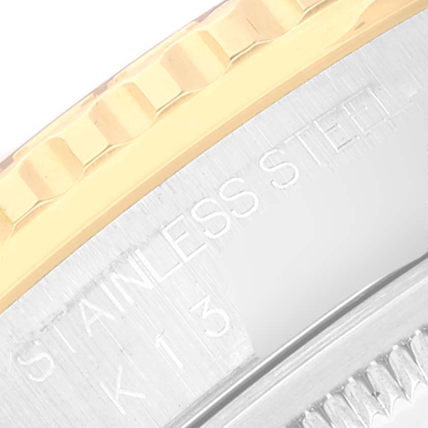 This image shows a close-up of the bezel and case edge of a Rolex Turn-o-Graph 16263 Men's Steel and Gold (two tone) Champagne Dial 16263 Men's Steel and Gold (two tone) Champagne Dial watch, highlighting the "STAINLESS STEEL" engraving.