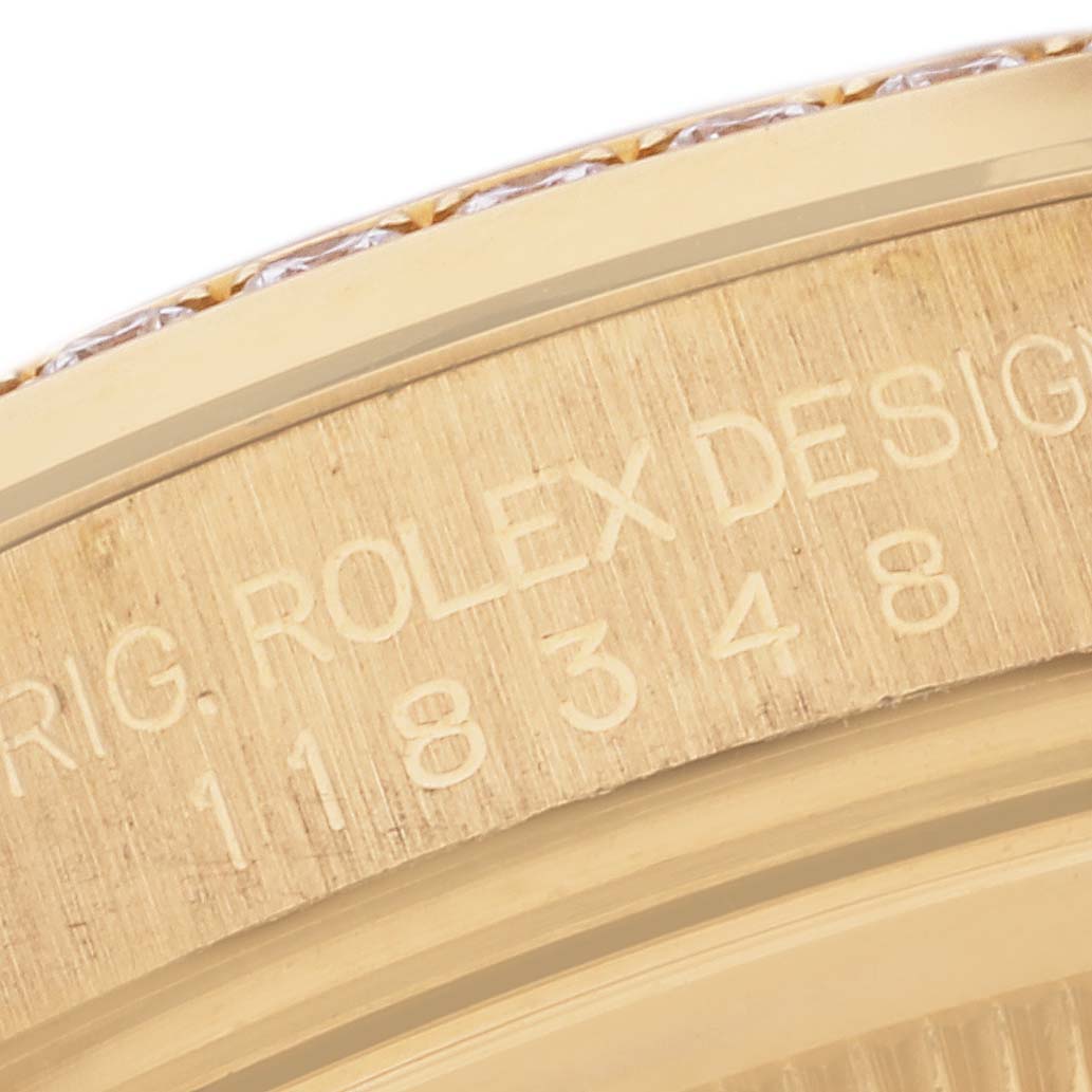 The image shows a close-up of the edge and engraving of a Rolex President 118348 Men's Yellow Gold Mother of Pearl Dial 118348 Men's Yellow Gold Mother of Pearl Dial model watch, prominently displaying part of the serial number.