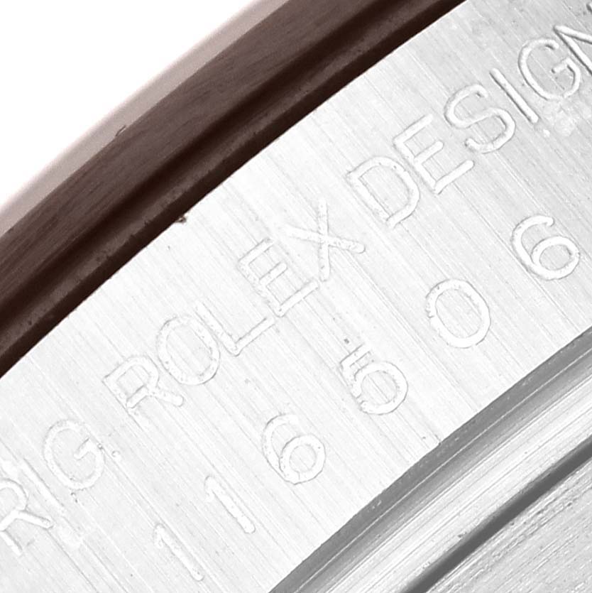 The image shows a close-up of the engraved serial number and "ORIG ROLEX DESIGN" text on the case of a Rolex Daytona 116506 Men's Platinum Blue Dial 116506 Men's Platinum Blue Dial watch.