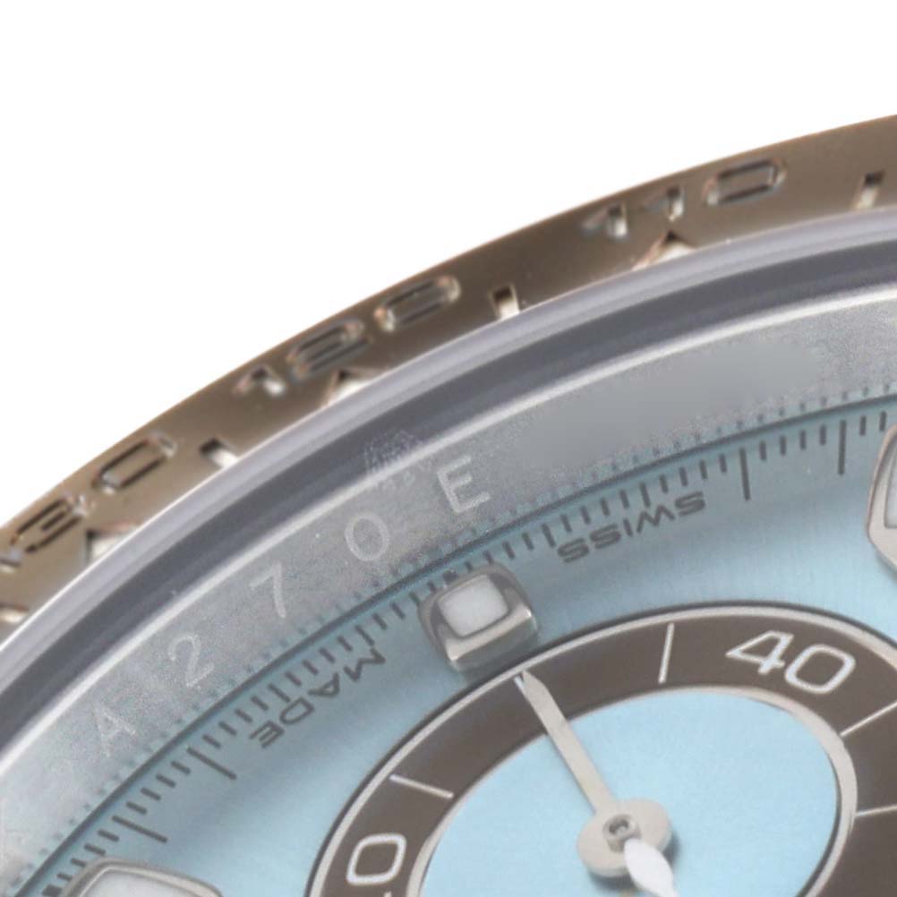 The image shows a close-up of the dial and bezel of a Rolex Daytona 116506 Men's Platinum Blue Dial 116506 Men's Platinum Blue Dial watch.
