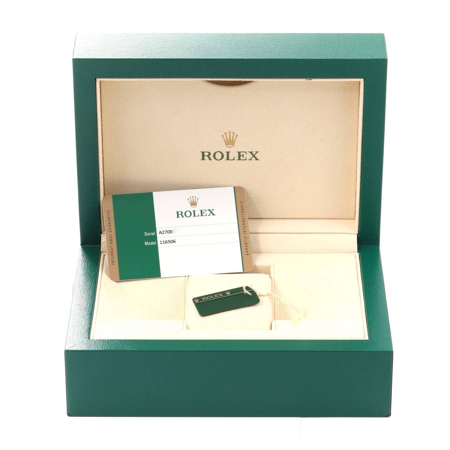 The image shows an open Rolex watch box for the Daytona model with a certificate card and a green Rolex tag inside.
