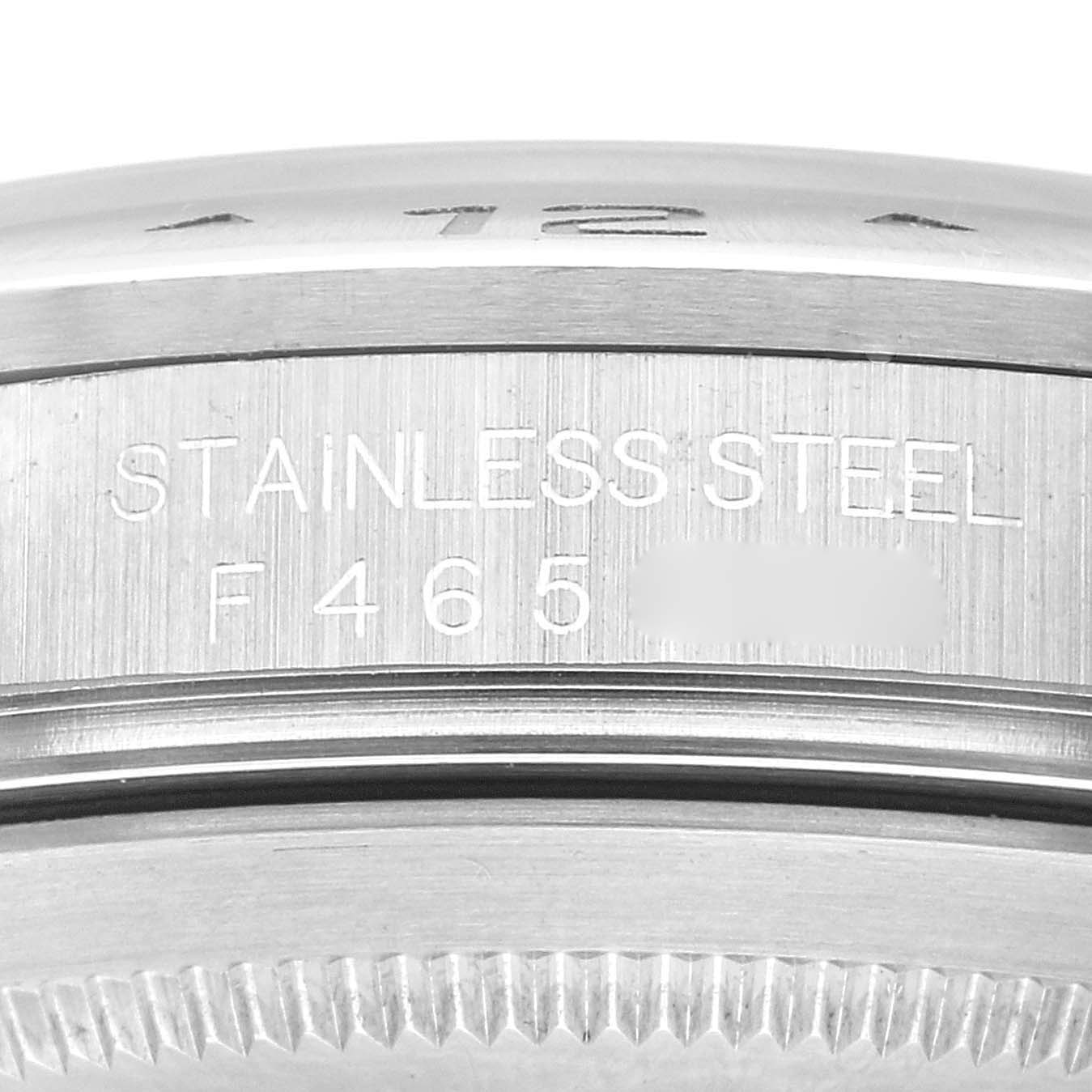 This close-up shows the stainless steel case back and part of the bezel of a Rolex Explorer 16570 Men's Stainless Steel White Dial 16570 Men's Stainless Steel White Dial watch.