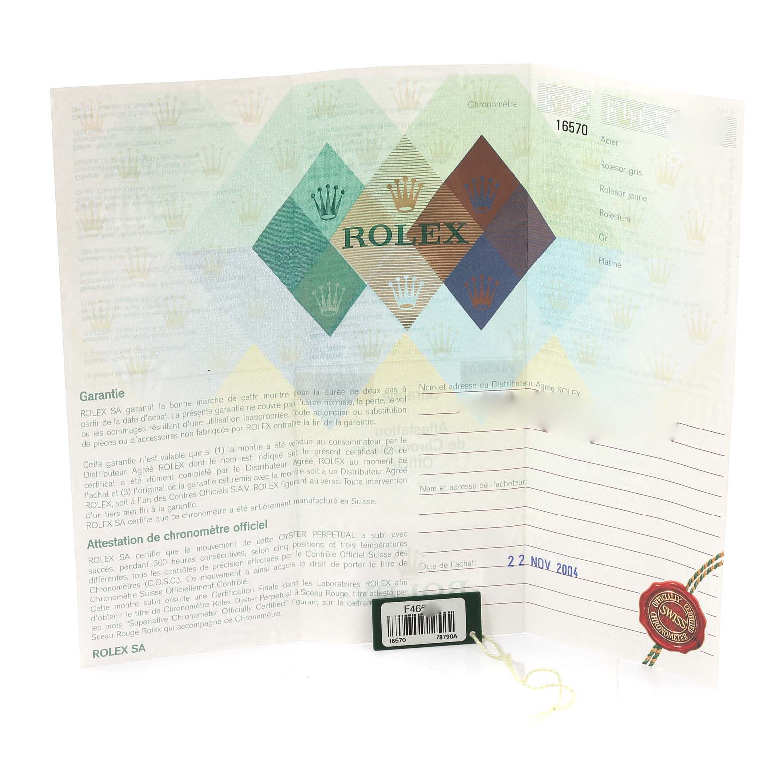 This image shows the warranty card and documentation for a Rolex Explorer 16570 Men's Stainless Steel White Dial 16570 Men's Stainless Steel White Dial model 16570 with a seal and a tag.