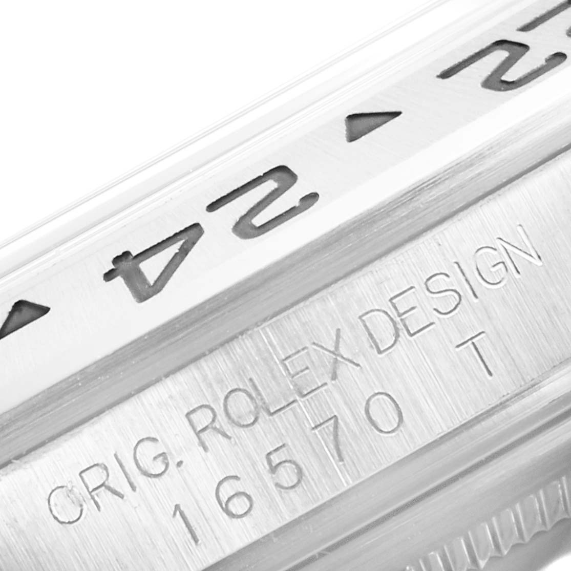 The image shows a close-up of the bezel and case engraving of a Rolex Explorer 16570 Men's Stainless Steel Black Dial 16570 Men's Stainless Steel Black Dial model watch.