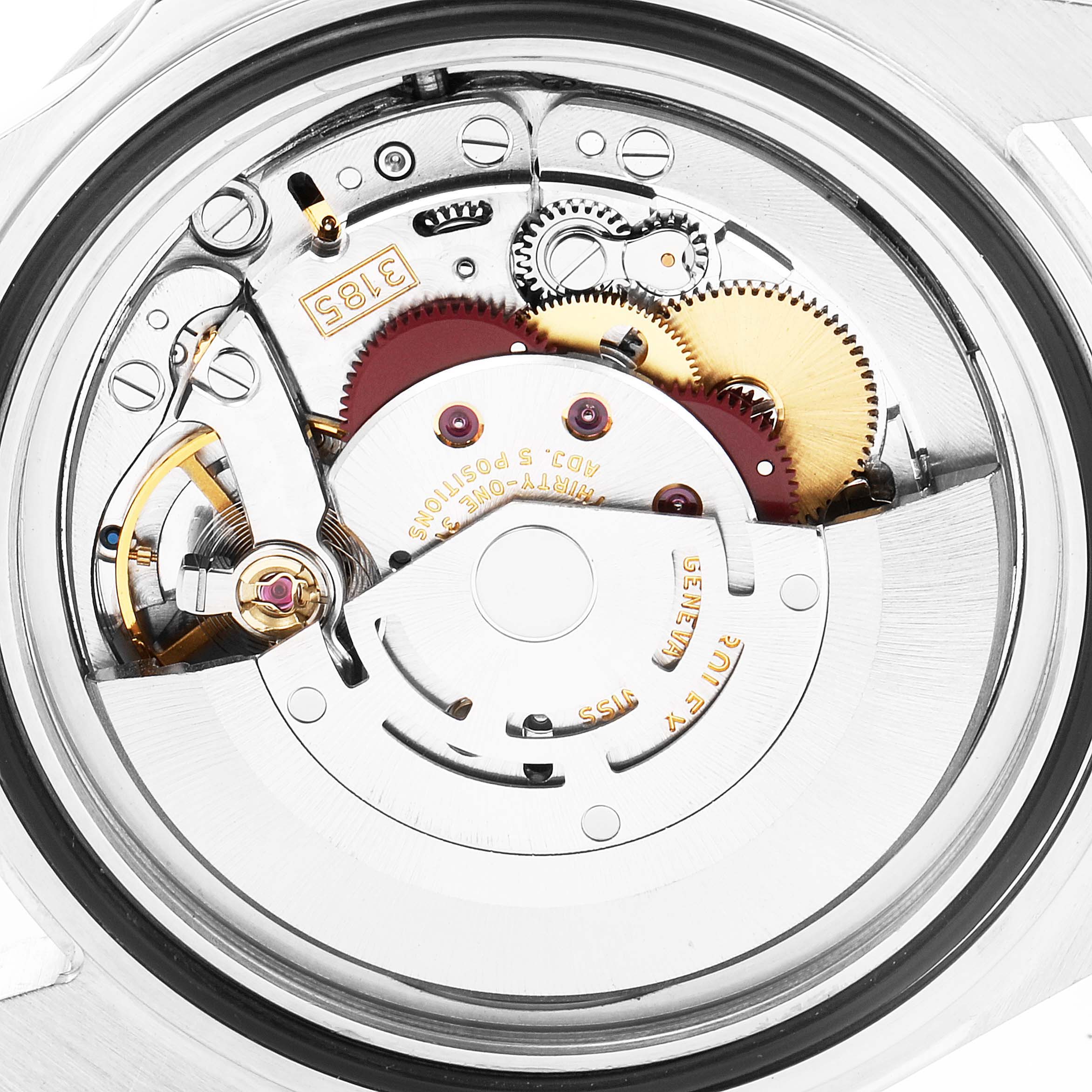 The image shows the internal movement mechanism of a Rolex Explorer 16570 Men's Stainless Steel Black Dial 16570 Men's Stainless Steel Black Dial watch, displaying gears, the rotor, and intricate components.