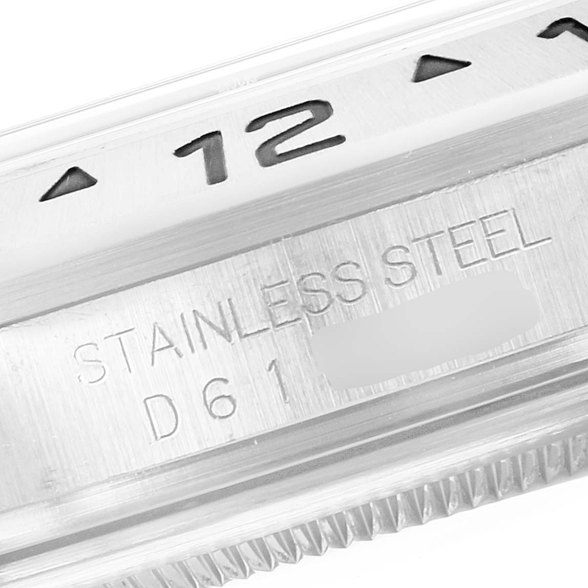 Close-up view of the bezel and engraving on the Rolex Explorer 16570 Men's Stainless Steel Black Dial 16570 Men's Stainless Steel Black Dial watch, highlighting the number 12 and "STAINLESS STEEL" text.