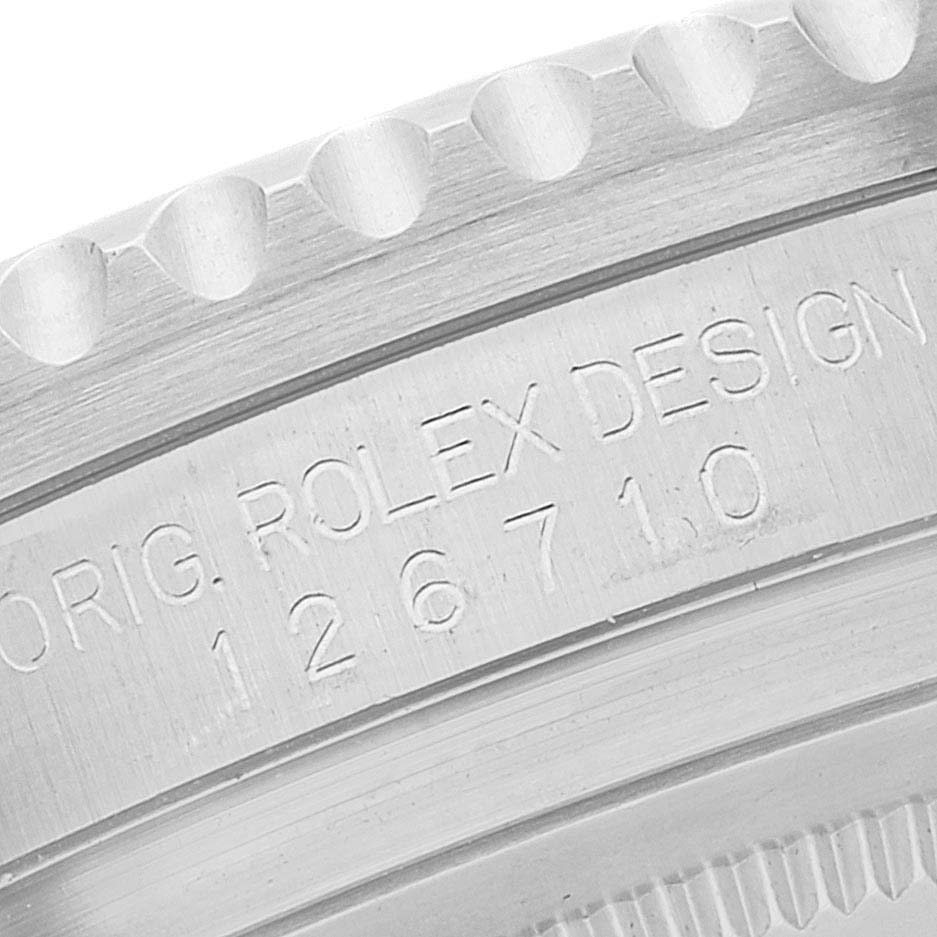 This close-up image of a Rolex GMT-Master 126710 Men
s Stainless Steel Black Dial 126710 Men
s Stainless Steel Black Dial shows the engraved model number and design details on the watch case.