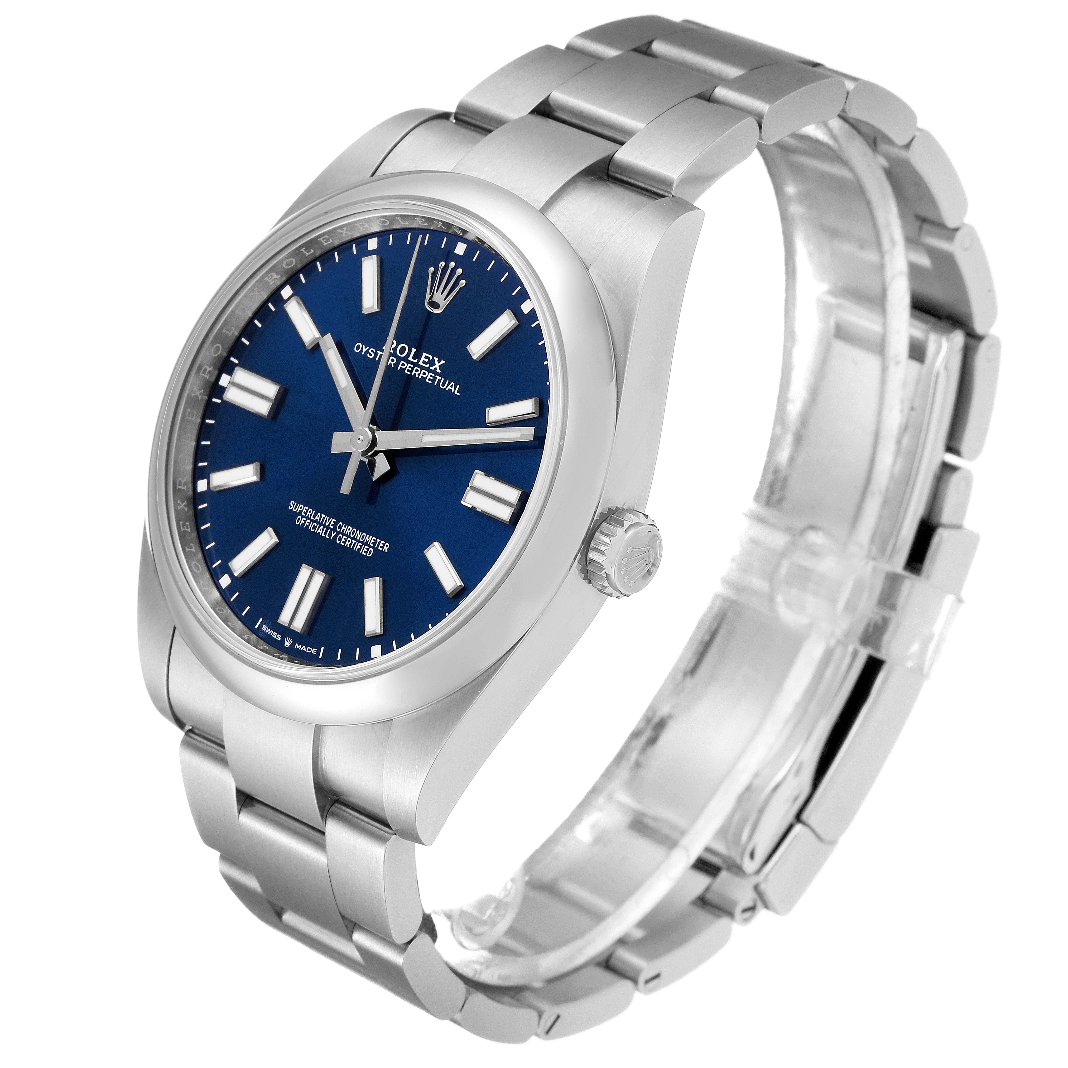 The image shows a Rolex Oyster Perpetual 124300 Men's Stainless Steel Blue Dial 124300 Men's Stainless Steel Blue Dial watch at a 3/4 angle, highlighting the face, bezel, crown, and bracelet.