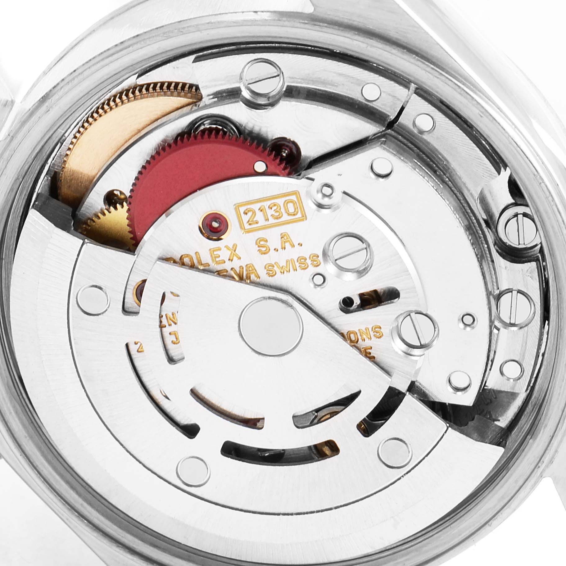 This image shows the exposed movement and inner mechanism of a Rolex Oyster Perpetual 67193 Women's Steel and Gold (two tone) Champagne Dial 67193 Women's Steel and Gold (two tone) Champagne Dial watch from a top-down angle.