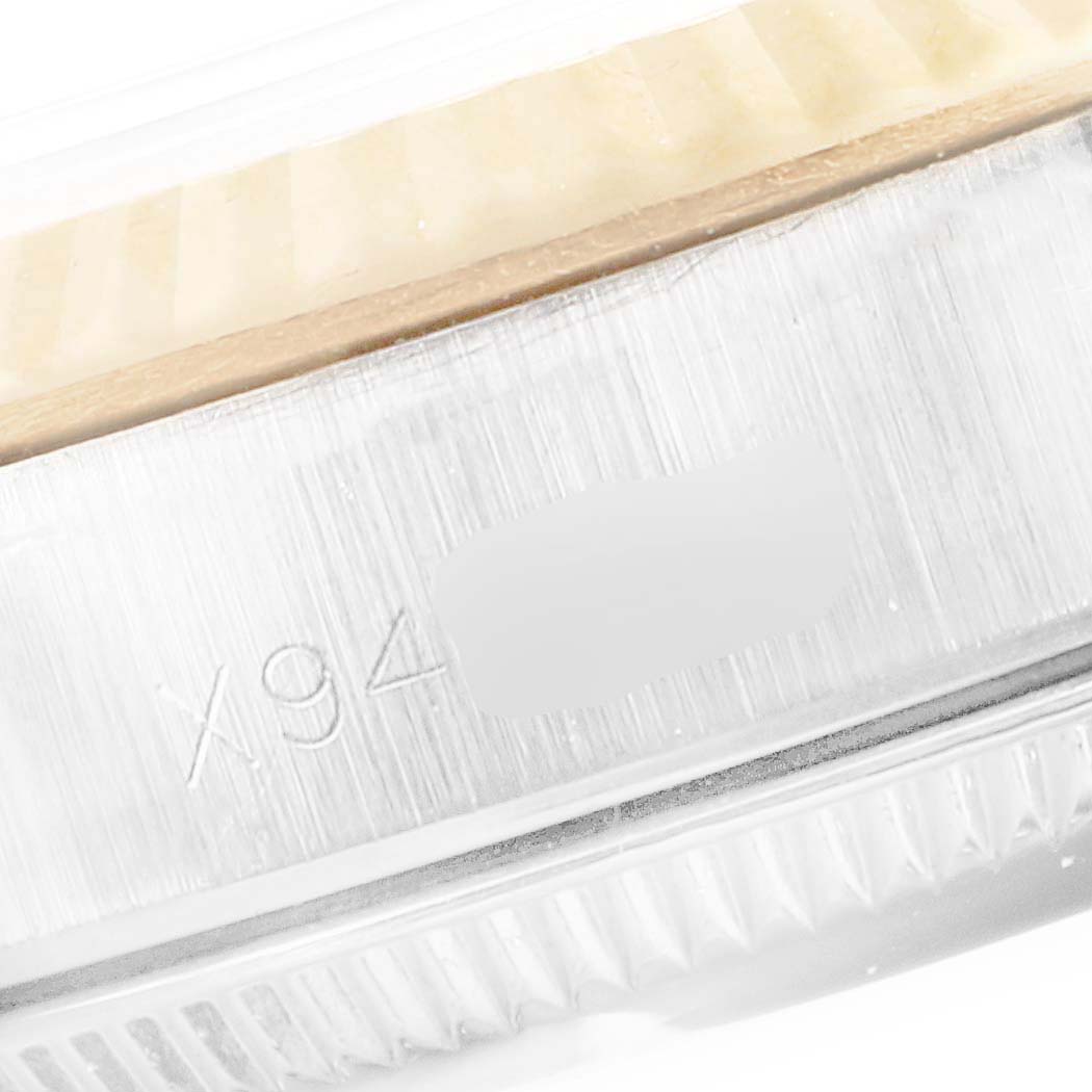 This close-up image shows the side view of the case and bezel of a Rolex Oyster Perpetual 67193 Women's Steel and Gold (two tone) Champagne Dial 67193 Women's Steel and Gold (two tone) Champagne Dial watch.