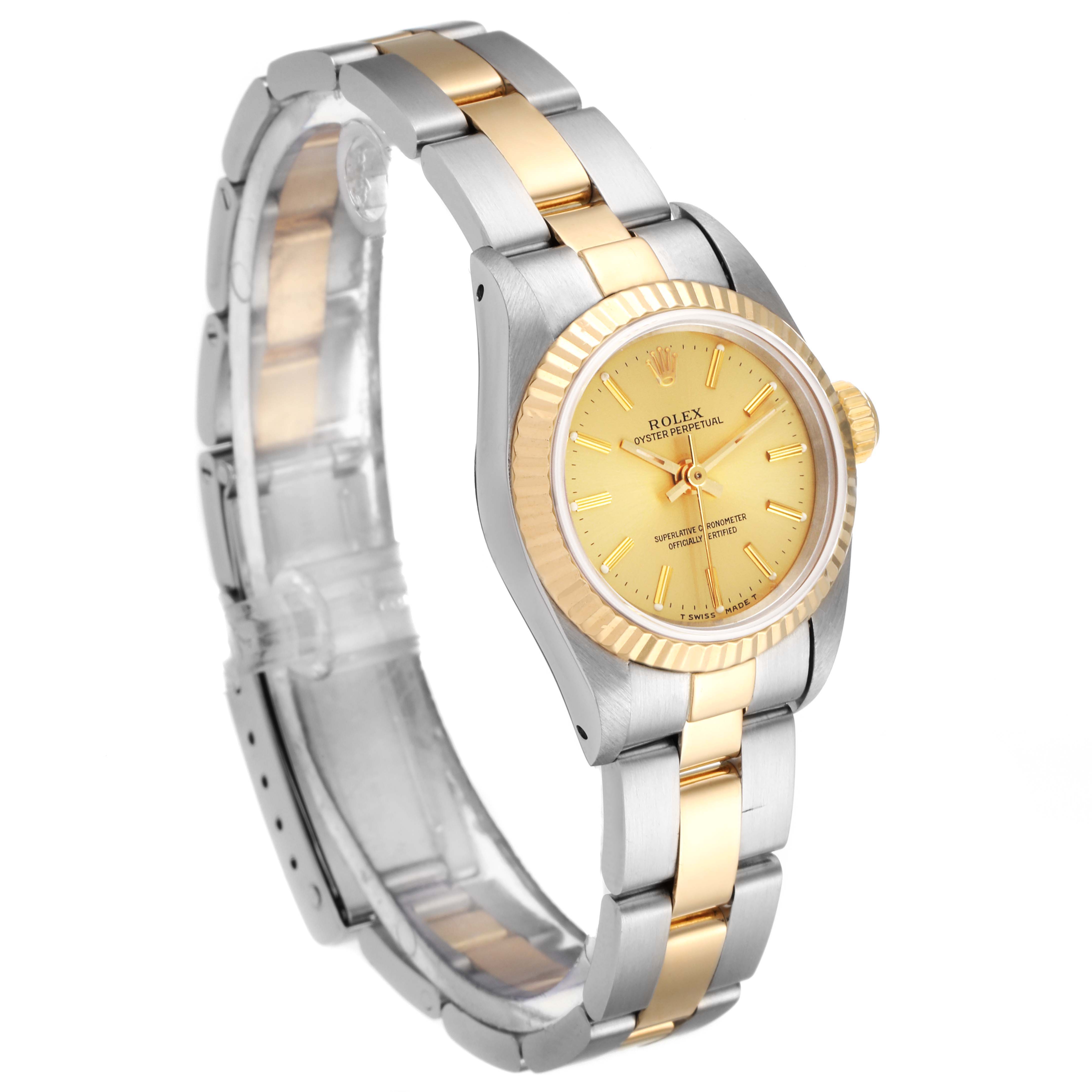 This image shows a Rolex Oyster Perpetual 67193 Women's Steel and Gold (two tone) Champagne Dial 67193 Women's Steel and Gold (two tone) Champagne Dial watch at a three-quarter angle highlighting its two-tone bracelet and gold dial.
