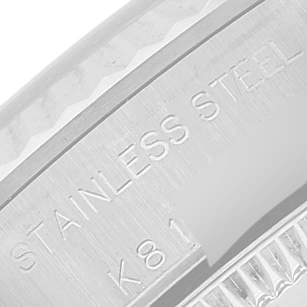 This close-up image shows the stainless steel casing of a Rolex Oyster Perpetual 76094 Women's Stainless Steel Black Dial 76094 Women's Stainless Steel Black Dial watch, highlighting the engraved details.