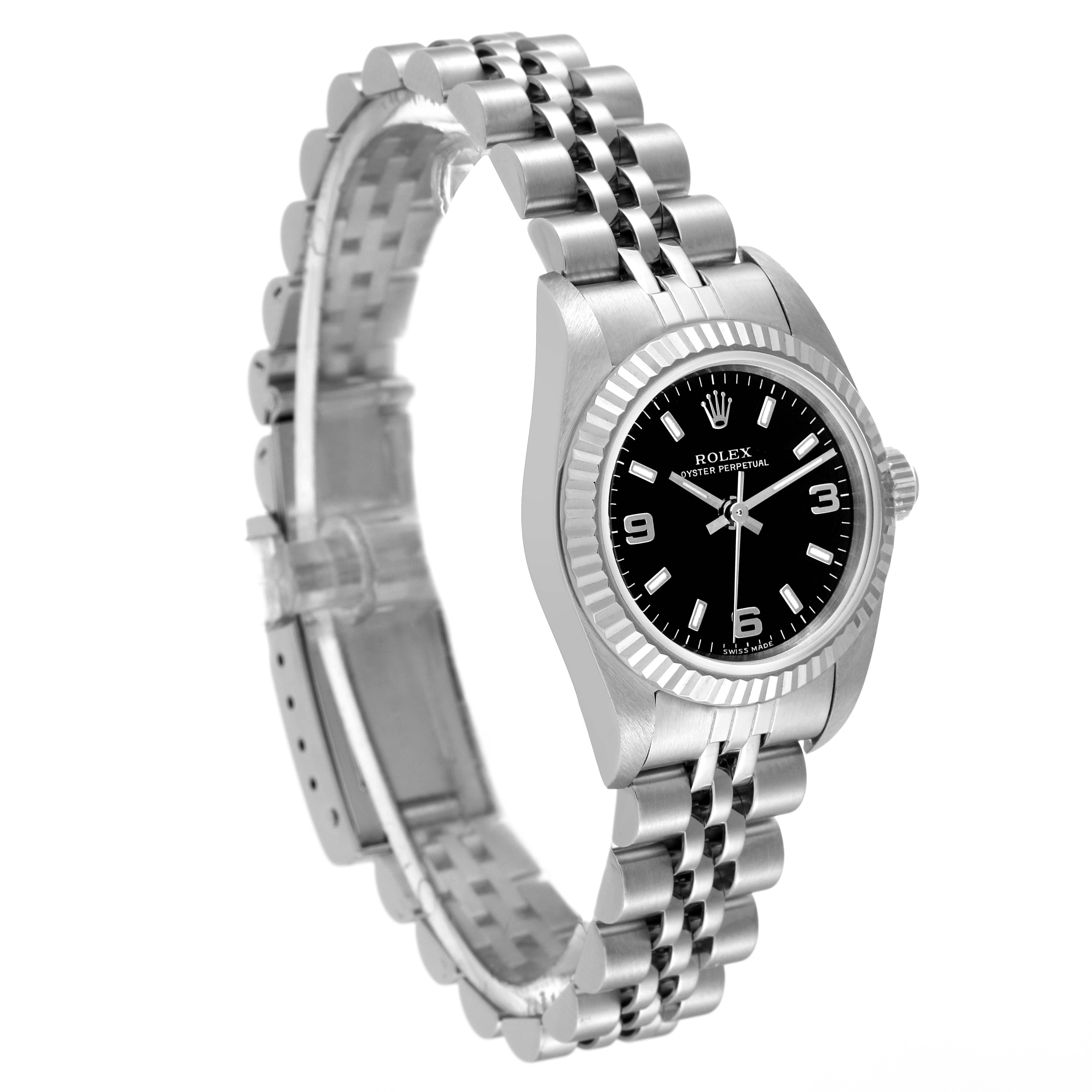 This image shows a side view angle of a Rolex Oyster Perpetual 76094 Women's Stainless Steel Black Dial 76094 Women's Stainless Steel Black Dial watch, displaying its dial, bezel, and bracelet.