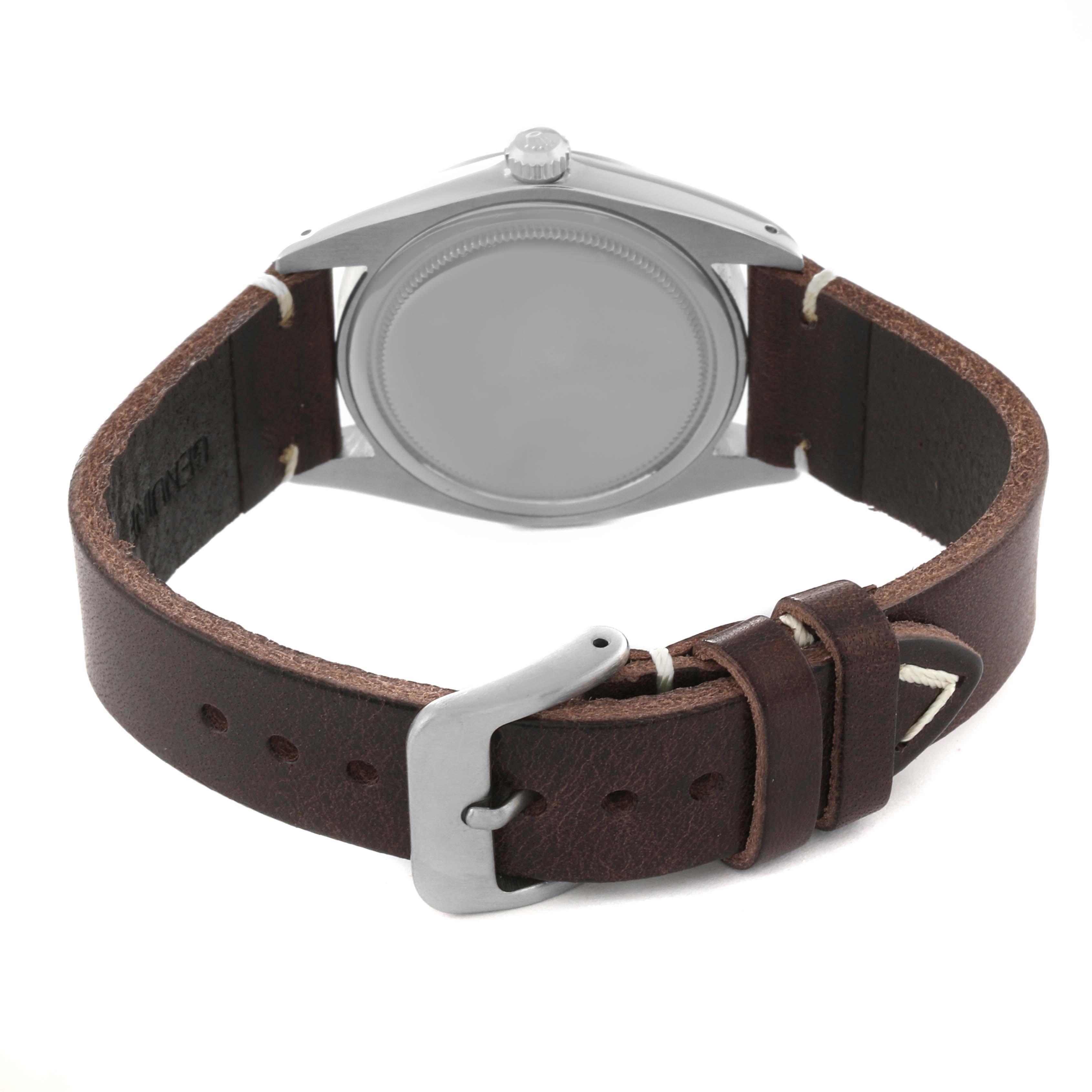 This image shows the back side and leather strap of a Vintage Collection Rolex watch.