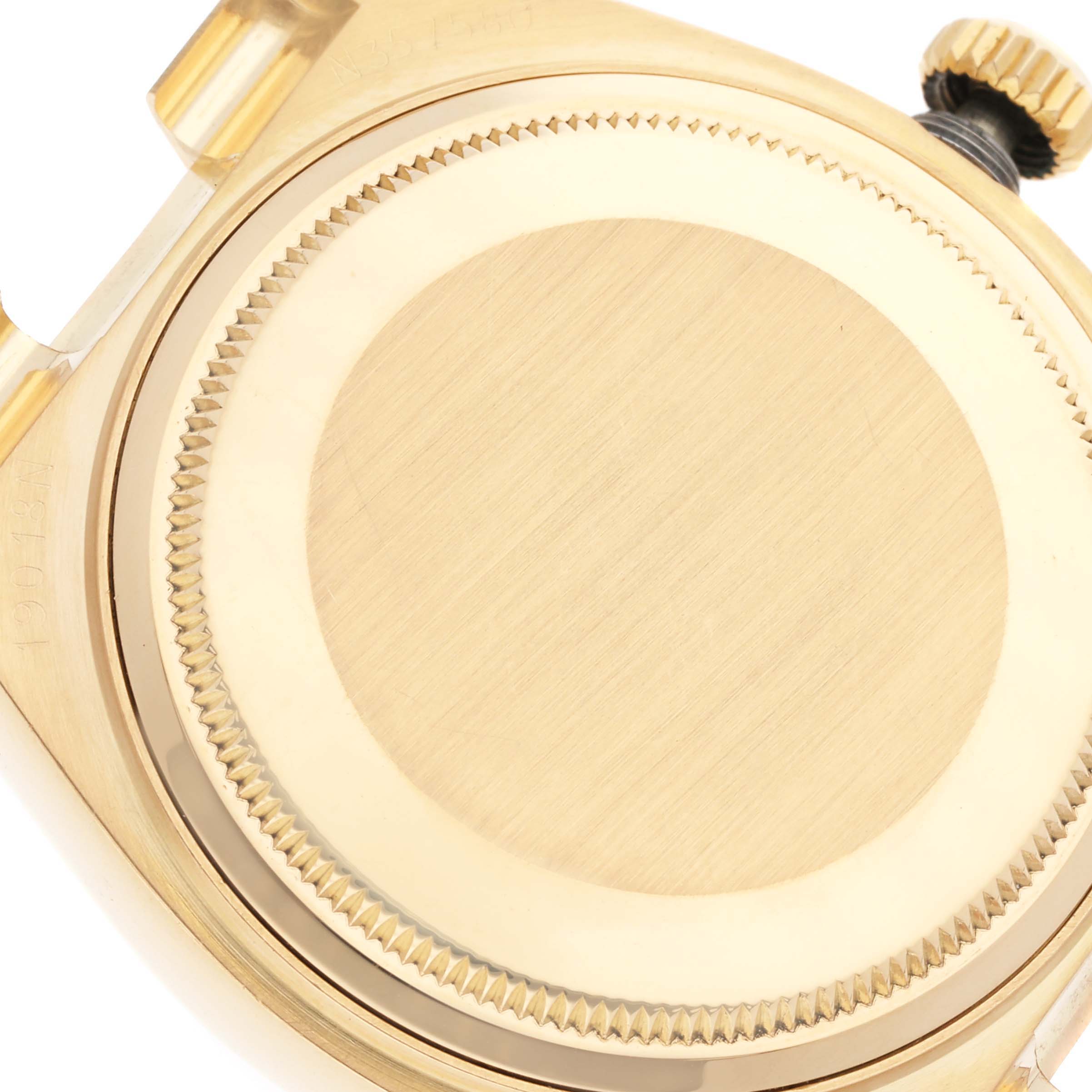 The image shows the case back and crown of a Rolex Oysterquartz 19018 Men's Yellow Gold Champagne Dial 19018 Men's Yellow Gold Champagne Dial watch from a top-down angle.