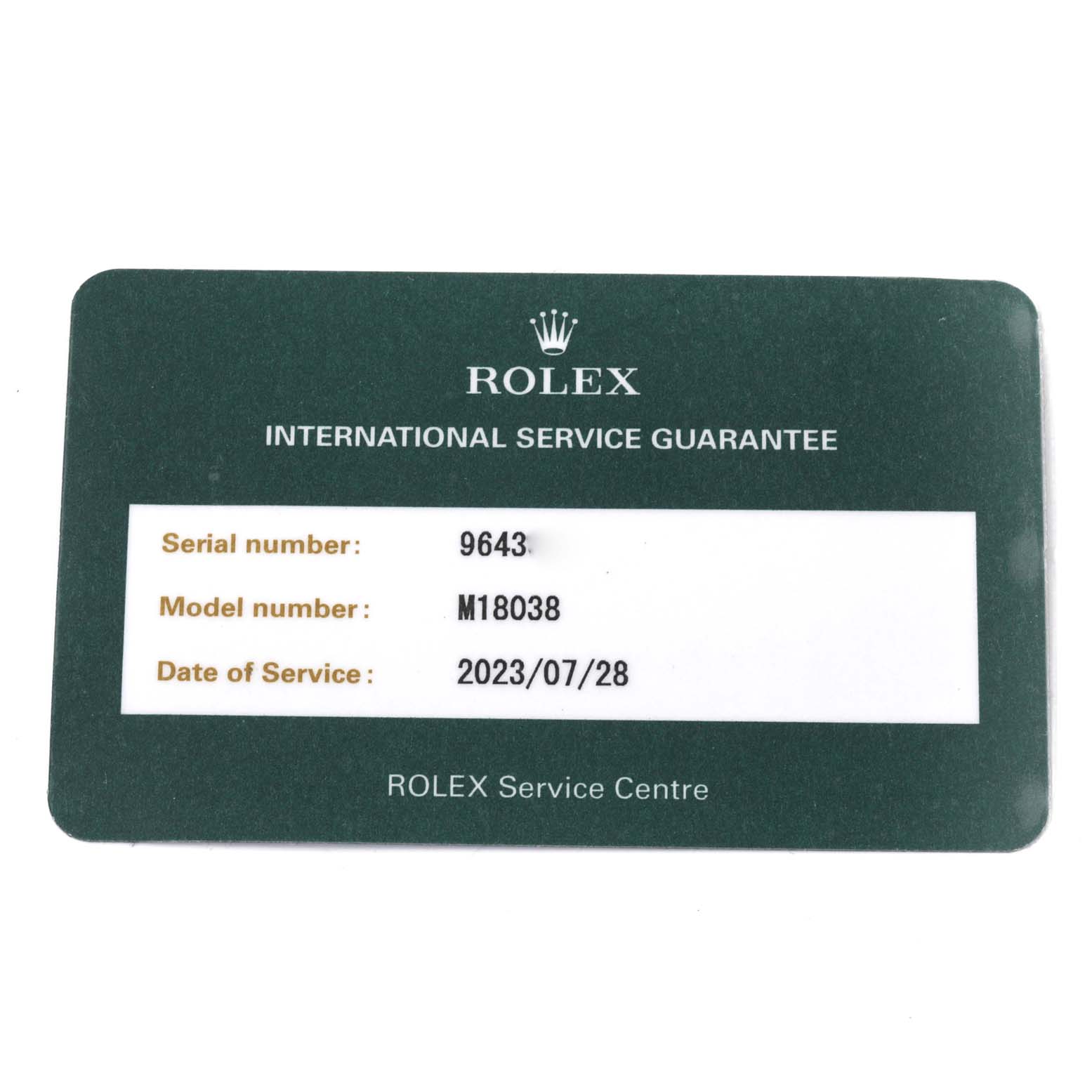 The image shows a Rolex International Service Guarantee card for the President model with serial number 9643 and model number M18038.