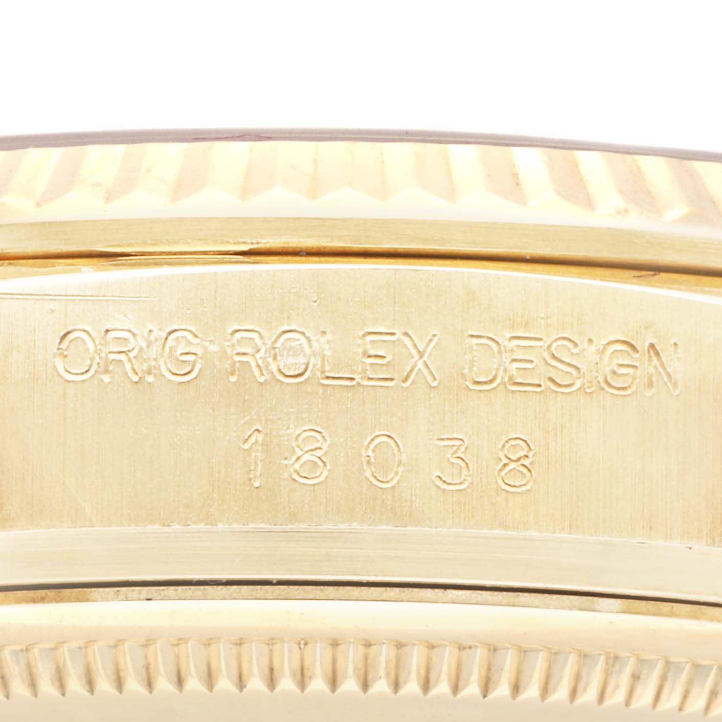 This image shows the side engraving of a Rolex President 18038 Men's Yellow Gold Champagne Dial 18038 Men's Yellow Gold Champagne Dial model watch case, featuring the text "ORIG ROLEX DESIGN" and the model number 18038.