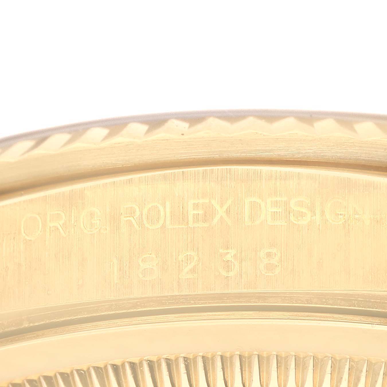 This image shows a close-up of the case side with engraved text, highlighting the Rolex President 18238 Men's Yellow Gold Blue Dial 18238 Men's Yellow Gold Blue Dial model details.