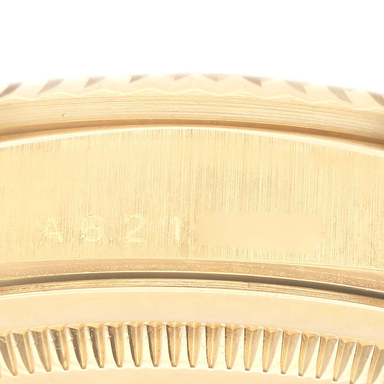 The image shows a close-up of the edge and serial number engraving on the case of a Rolex President 18238 Men's Yellow Gold Blue Dial 18238 Men's Yellow Gold Blue Dial model.