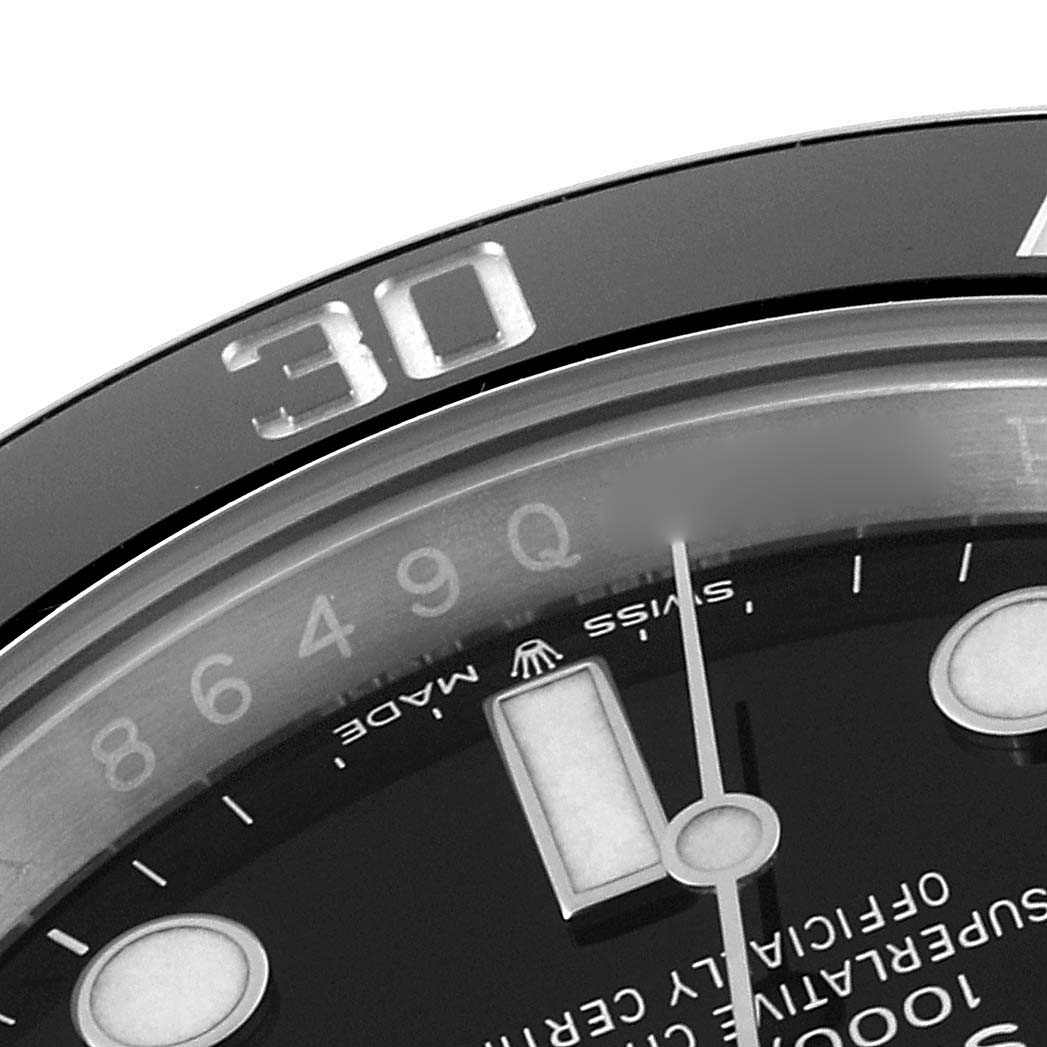 This is a close-up image of the bezel and part of the dial of a Rolex Submariner 126610LN Men
s Stainless Steel Black Dial 126610LN Men
s Stainless Steel Black Dial watch, showing the number 30 and minute markers.