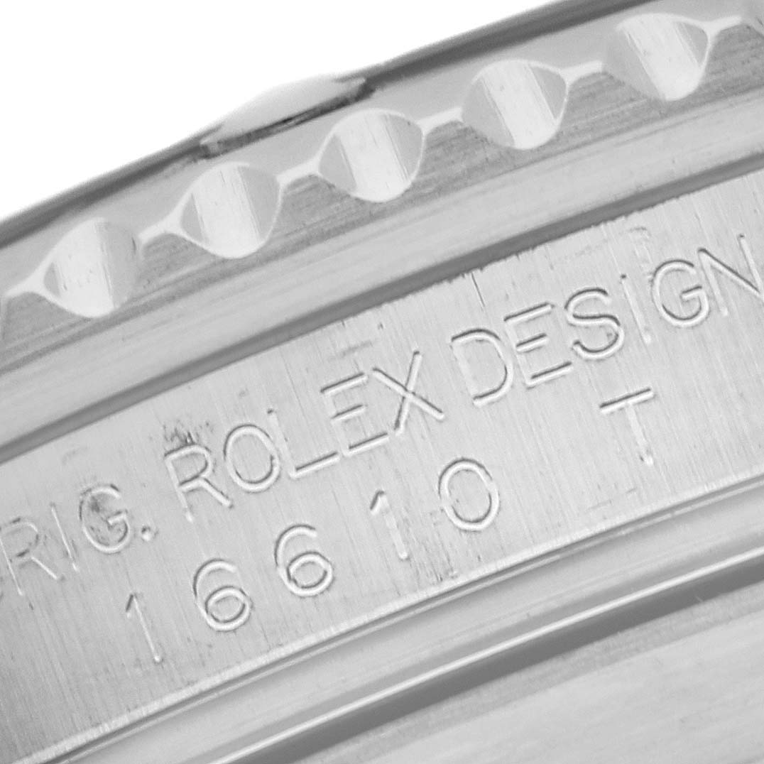 This close-up image shows the engraving on the side of the case of a Rolex Submariner 16610 Men
s Stainless Steel Black Dial 16610 Men
s Stainless Steel Black Dial model 16610.