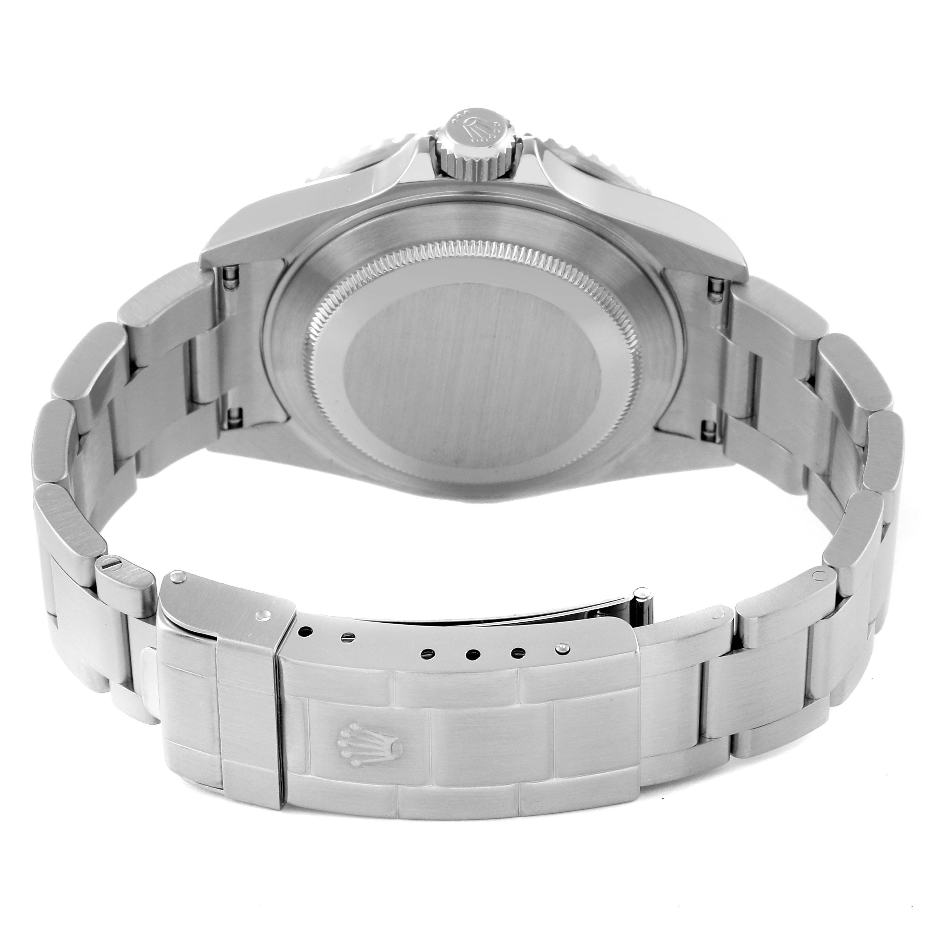 This image shows the backside of a Rolex Submariner 16610 Men
s Stainless Steel Black Dial 16610 Men
s Stainless Steel Black Dial watch, highlighting its case back and metal bracelet with a clasp.