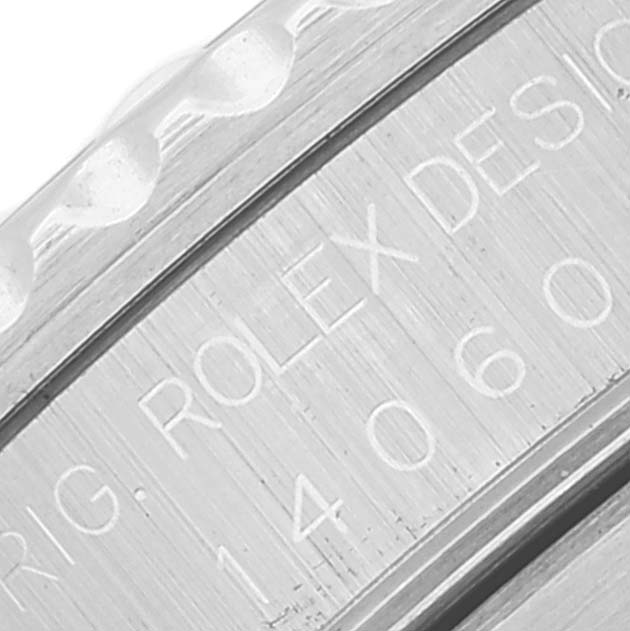 The image shows a close-up of the case side of the Rolex Submariner 14060 Men's Stainless Steel Black Dial 14060 Men's Stainless Steel Black Dial, focusing on the engraved text and model number.