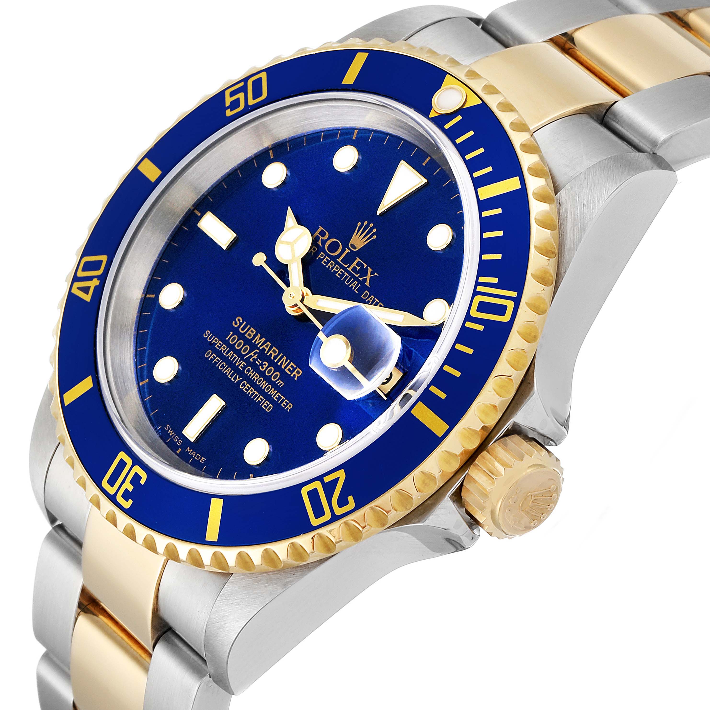 This image shows a close-up of the Rolex Submariner 16613 Men
s Steel and Gold (two tone) Blue Dial 16613 Men
s Steel and Gold (two tone) Blue Dial watch, focusing on the dial, bezel, and part of the bracelet.