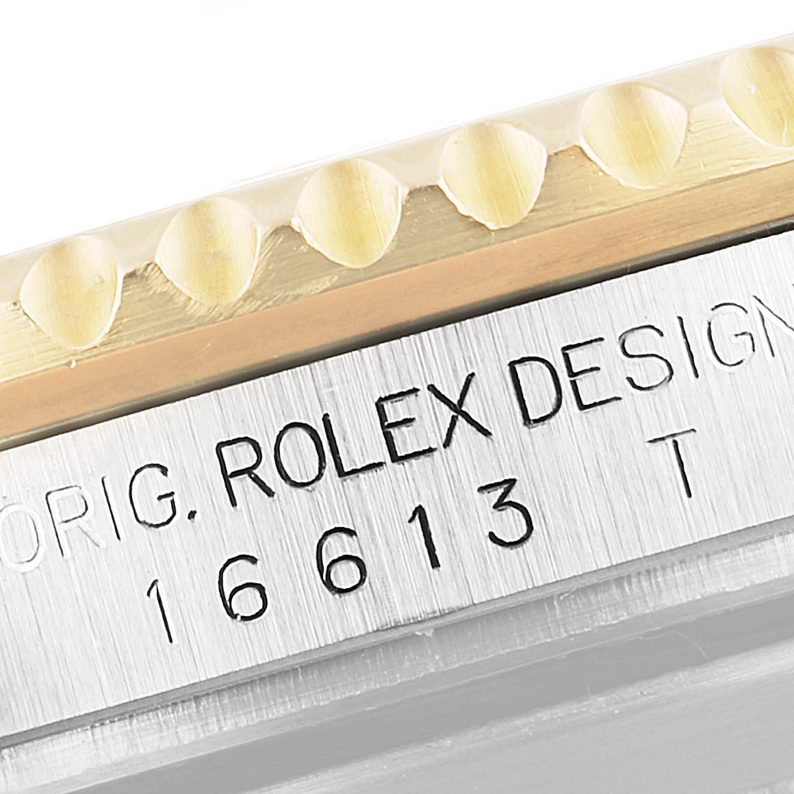 The image shows a close-up of the bezel and case with the model number and "Rolex" inscription on a Rolex Submariner 16613 Men
s Steel and Gold (two tone) Blue Dial 16613 Men
s Steel and Gold (two tone) Blue Dial.