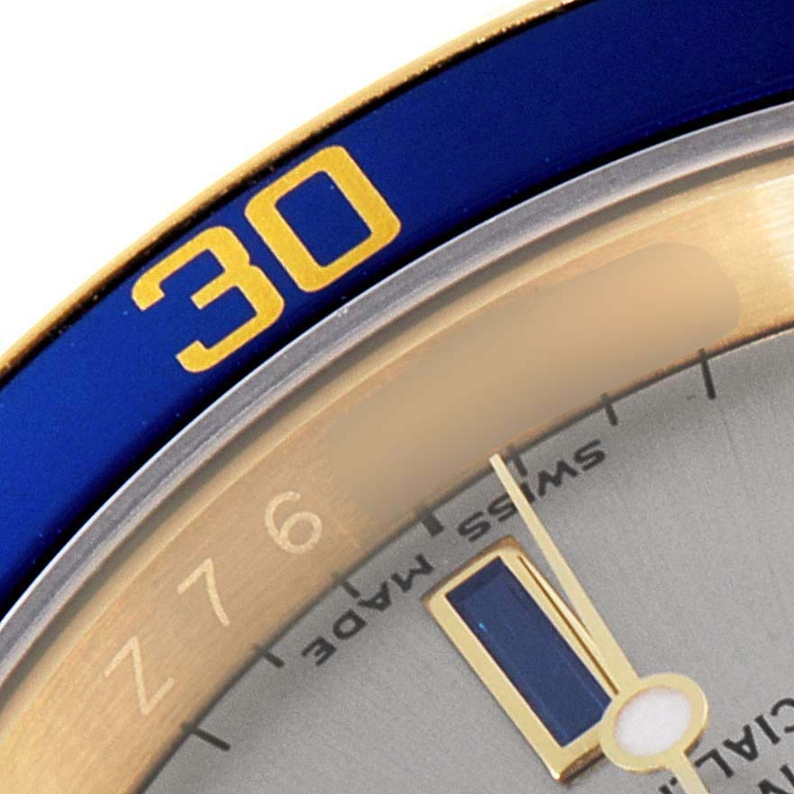 This image shows a close-up angle of the bezel and dial of a Rolex Submariner 16618 Men's Yellow Gold Grey Dial 16618 Men's Yellow Gold Grey Dial watch, highlighting the "30" minute marker.