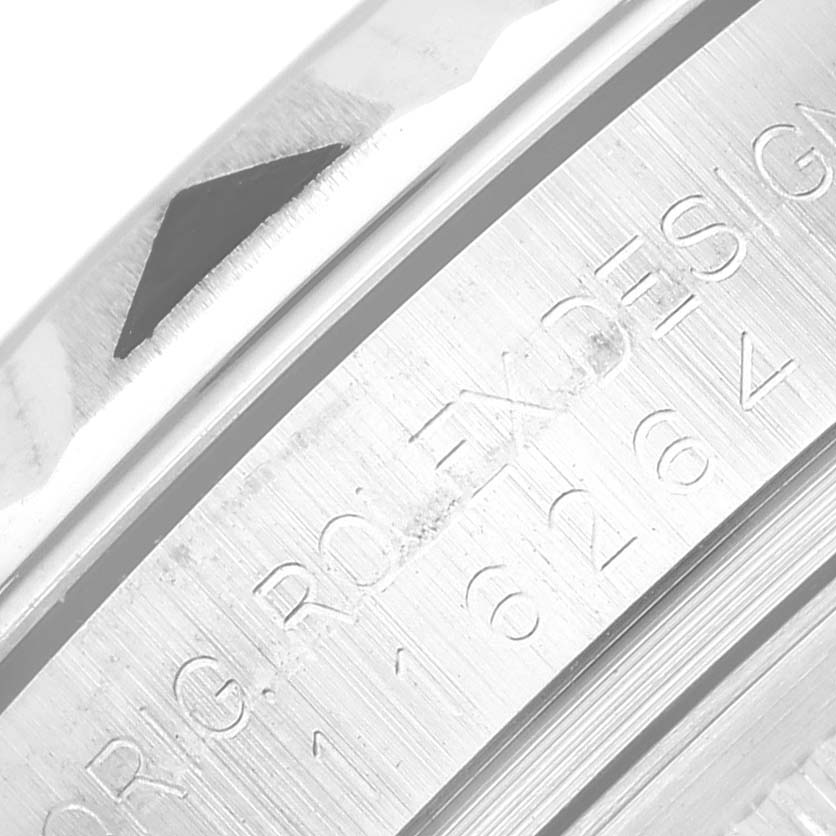 This image shows a close-up of the outer bezel and engraved inner bezel of a Rolex Turn-o-Graph 116264 Men
s Stainless Steel White Dial 116264 Men
s Stainless Steel White Dial watch.