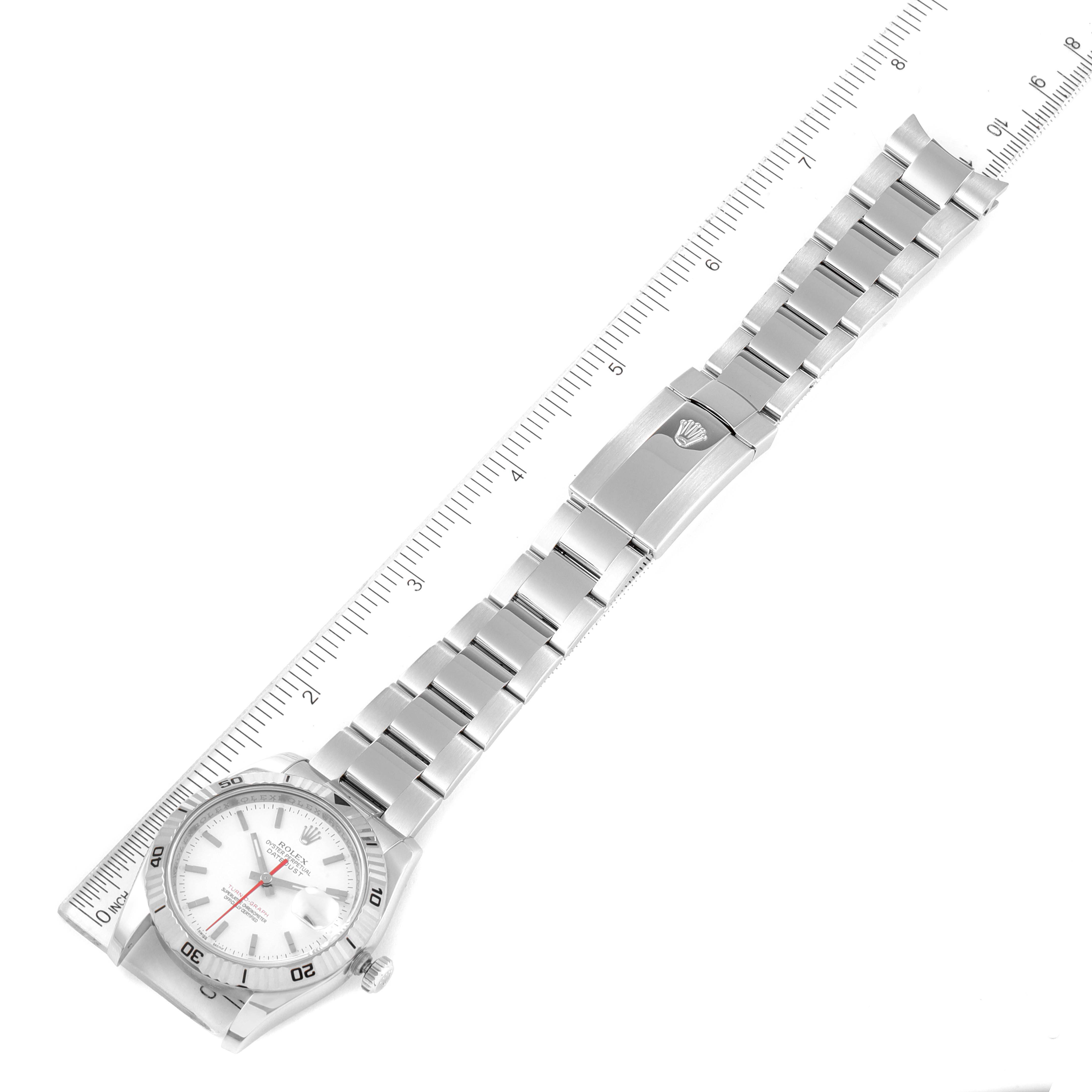 The image shows a top-down view of a Rolex Turn-o-Graph 116264 Men's Stainless Steel White Dial 116264 Men's Stainless Steel White Dial watch displaying both the face and full bracelet, with a ruler for scale.